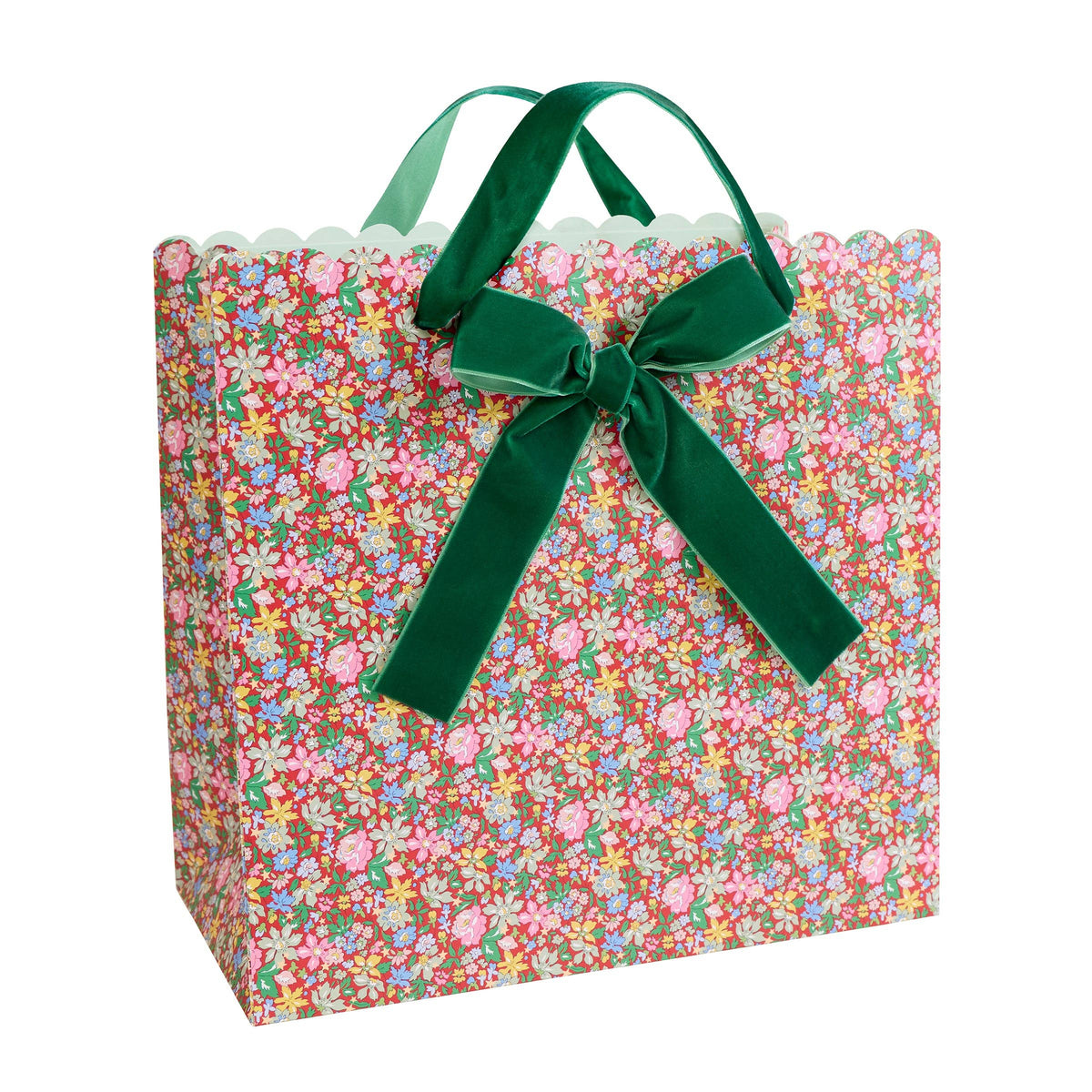 Floral-patterned gift bag with a green ribbon on a white background