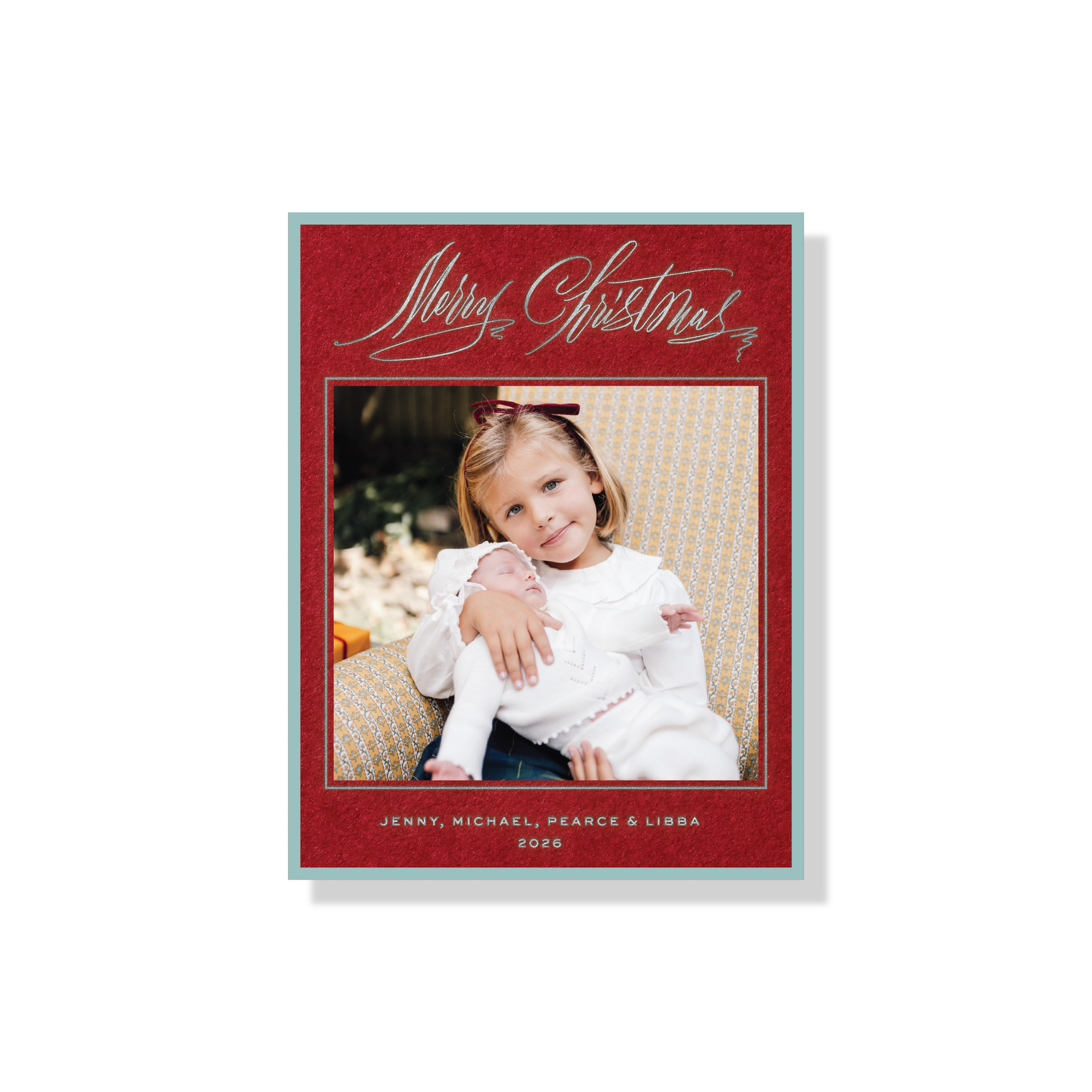 Aldridge Engraved Photo Card, featuring family holiday photos framed in burgundy and teal with elegant engraved “Merry Christmas” calligraphy and personalized family names.