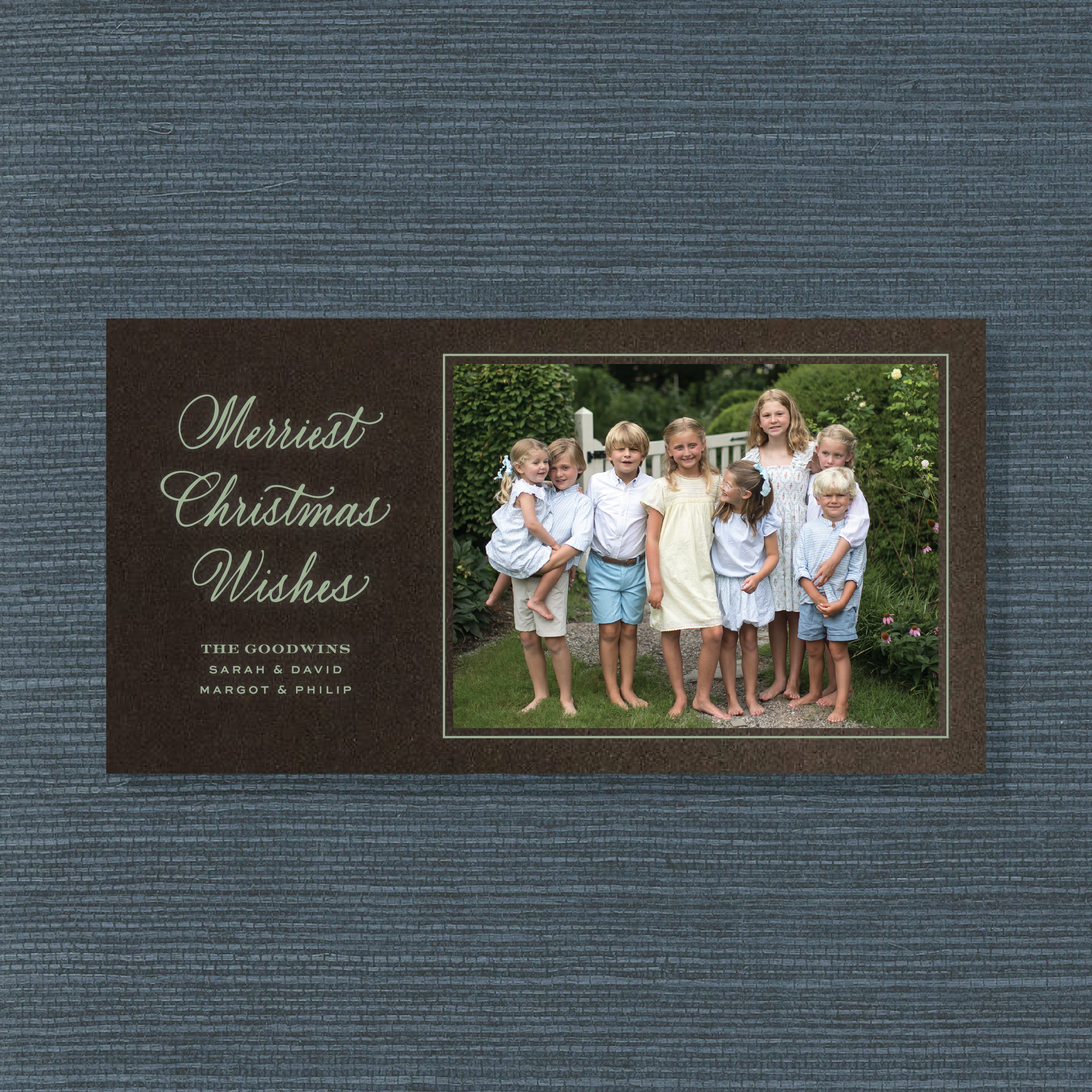 Goodwin Engraved Holiday Card featuring hand-lettered “Merriest Christmas Wishes” artwork, a family photograph, and traditional engraving.