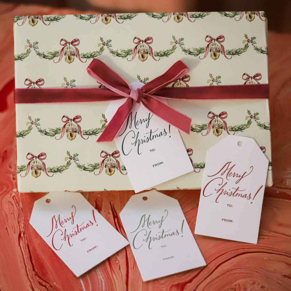 Shop Merry Christmas Gift Tags in sets of 8, featuring elegant hand-lettered lettering, To and From lines, and coordinating color options for holiday wrapping.