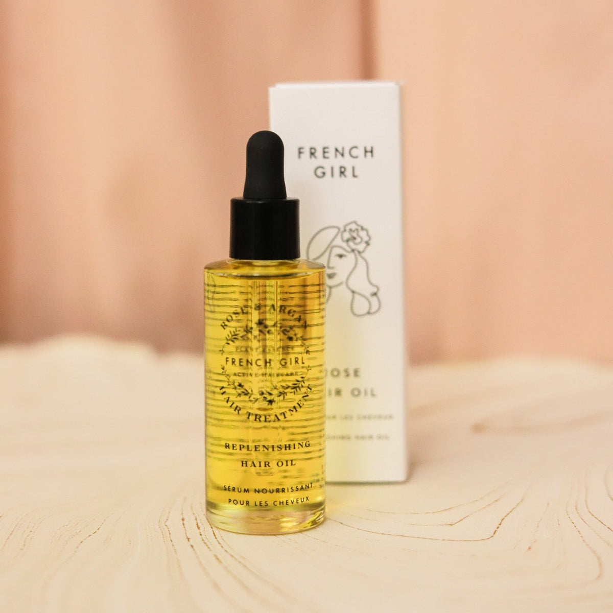 French Girl Rose Hair Oil smooths frizz, softens dry hair and adds lightweight shine with nourishing argan, tamanu, hemp and rosehip oils.