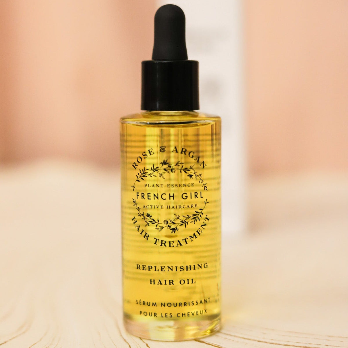 French Girl Rose Hair Oil smooths frizz, softens dry hair and adds lightweight shine with nourishing argan, tamanu, hemp and rosehip oils.