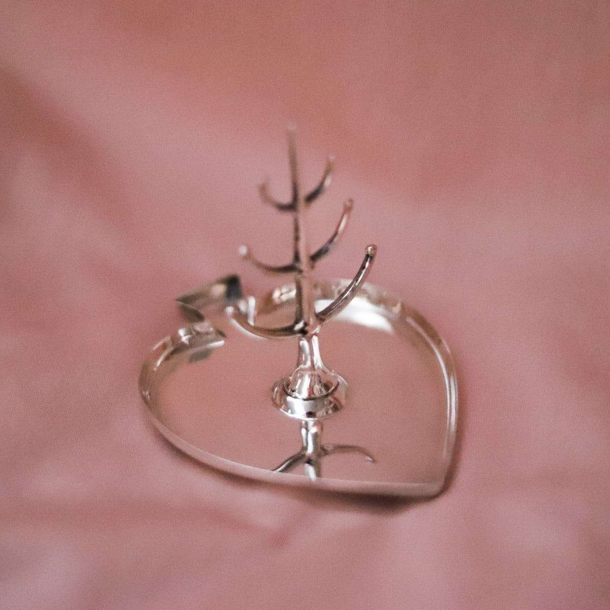 This antique sterling silver ring tree was made in Birmingham, England and hallmarked in 1921, during the reign of King George V.