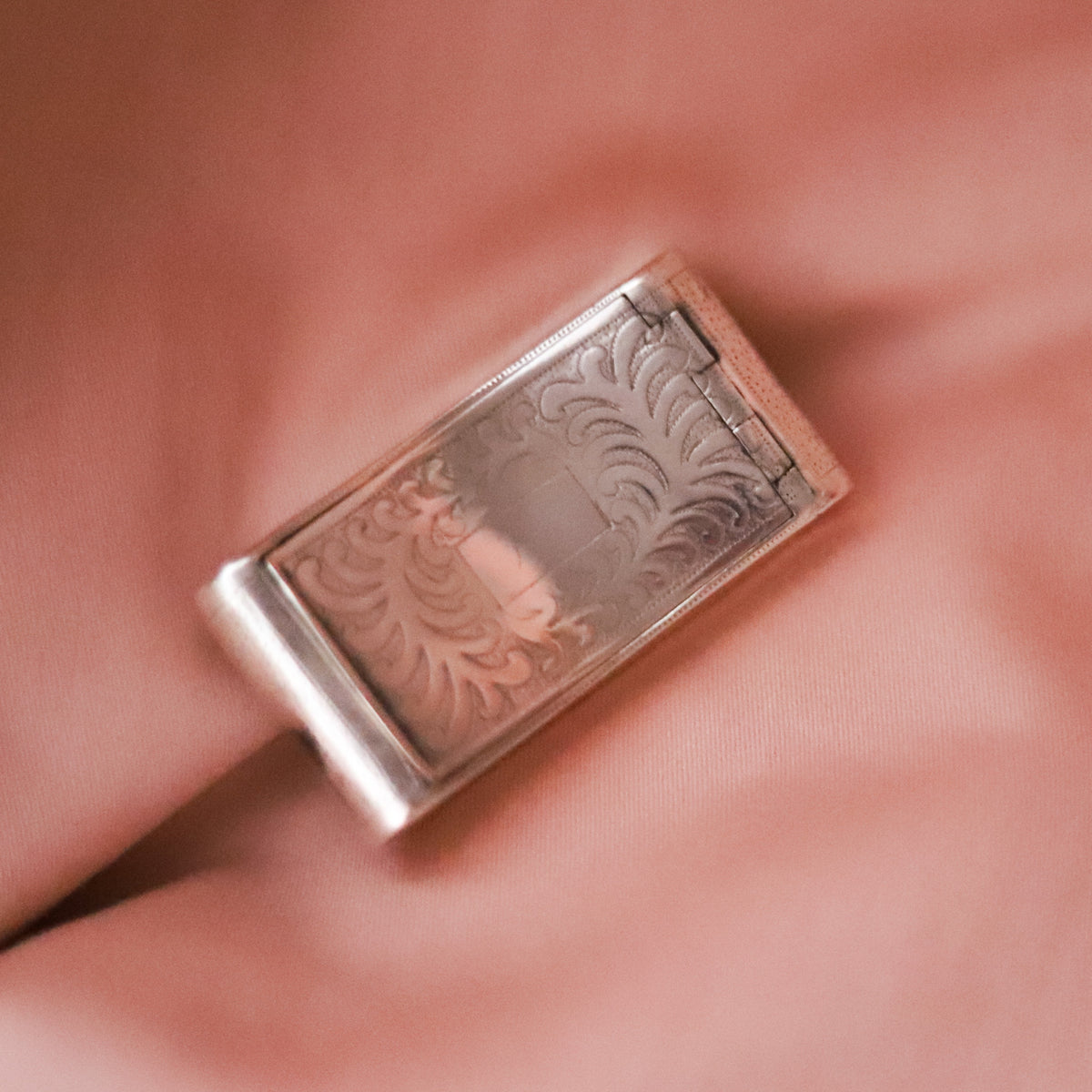 A tiny treasure with more than two centuries of history, this antique sterling silver box was made in Birmingham, England and hallmarked in 1818, during the reign of King George III