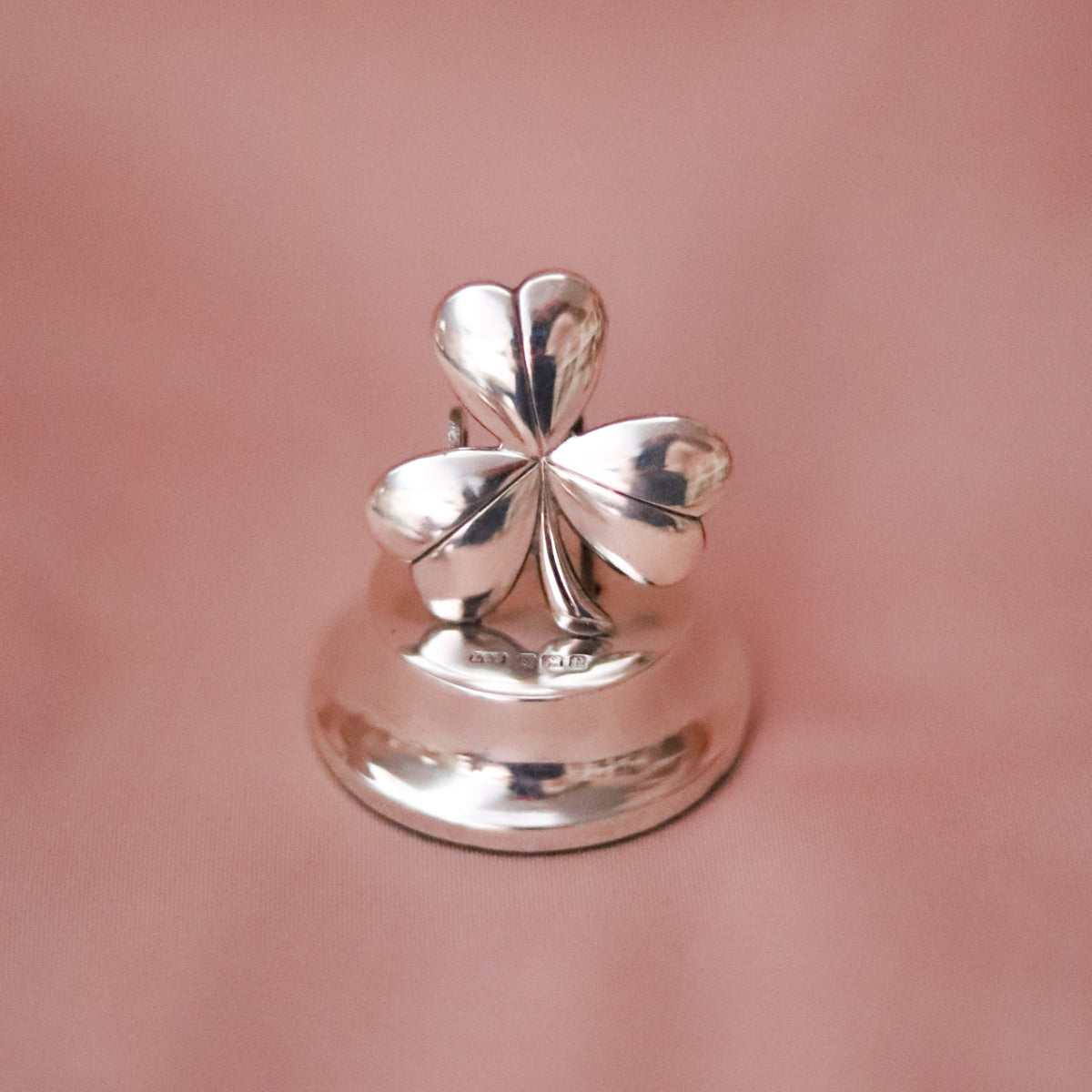 A little piece of good luck, more than a century old. This charming four-leaf clover paperweight was crafted in sterling silver and hallmarked in Birmingham, England in 1912.