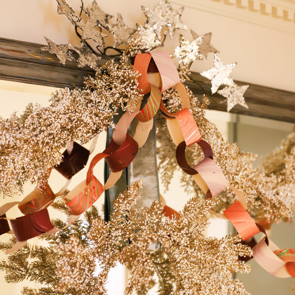 Marbled Paper Chain Kit with colorful pre-cut paper strips for handmade holiday and birthday garland decor.