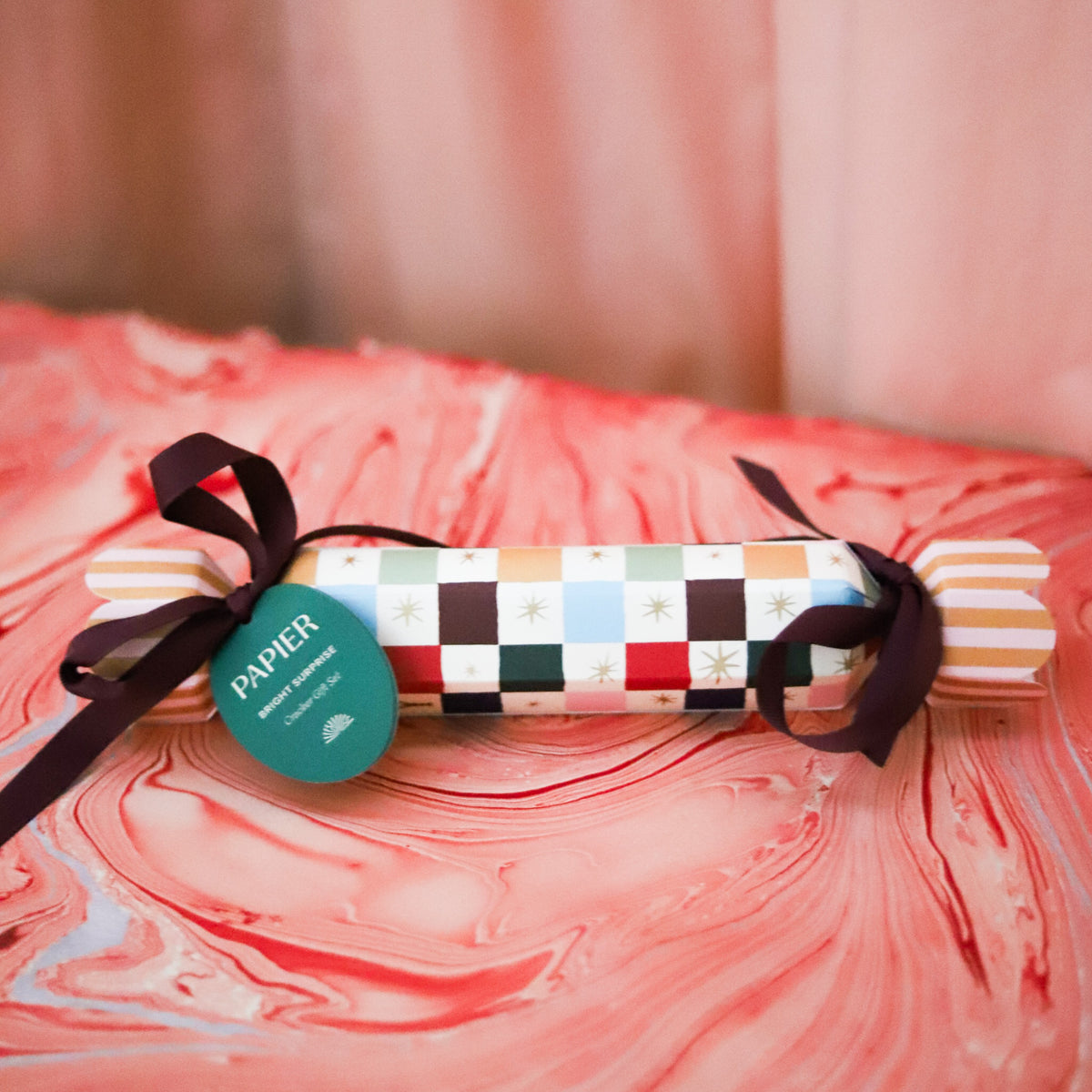 Add a festive pop to your holiday assortment with Papier’s Cracker Stocking Stuffer. Designed for gifting, this eye-catching cracker includes three vibrant fineliners—ideal for customers shopping for stationery lovers, creatives, or journalers.