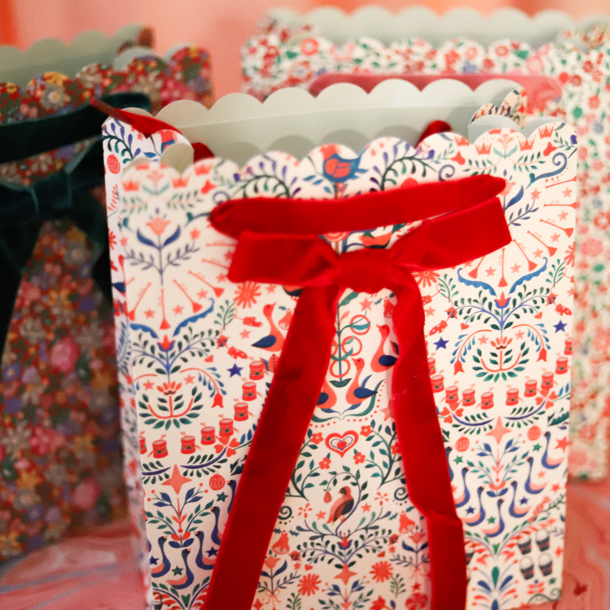 Make holiday gifting feel extra special with this set of three Liberty print gift bags, each featuring a different festive floral pattern in beautifully layered seasonal colors.