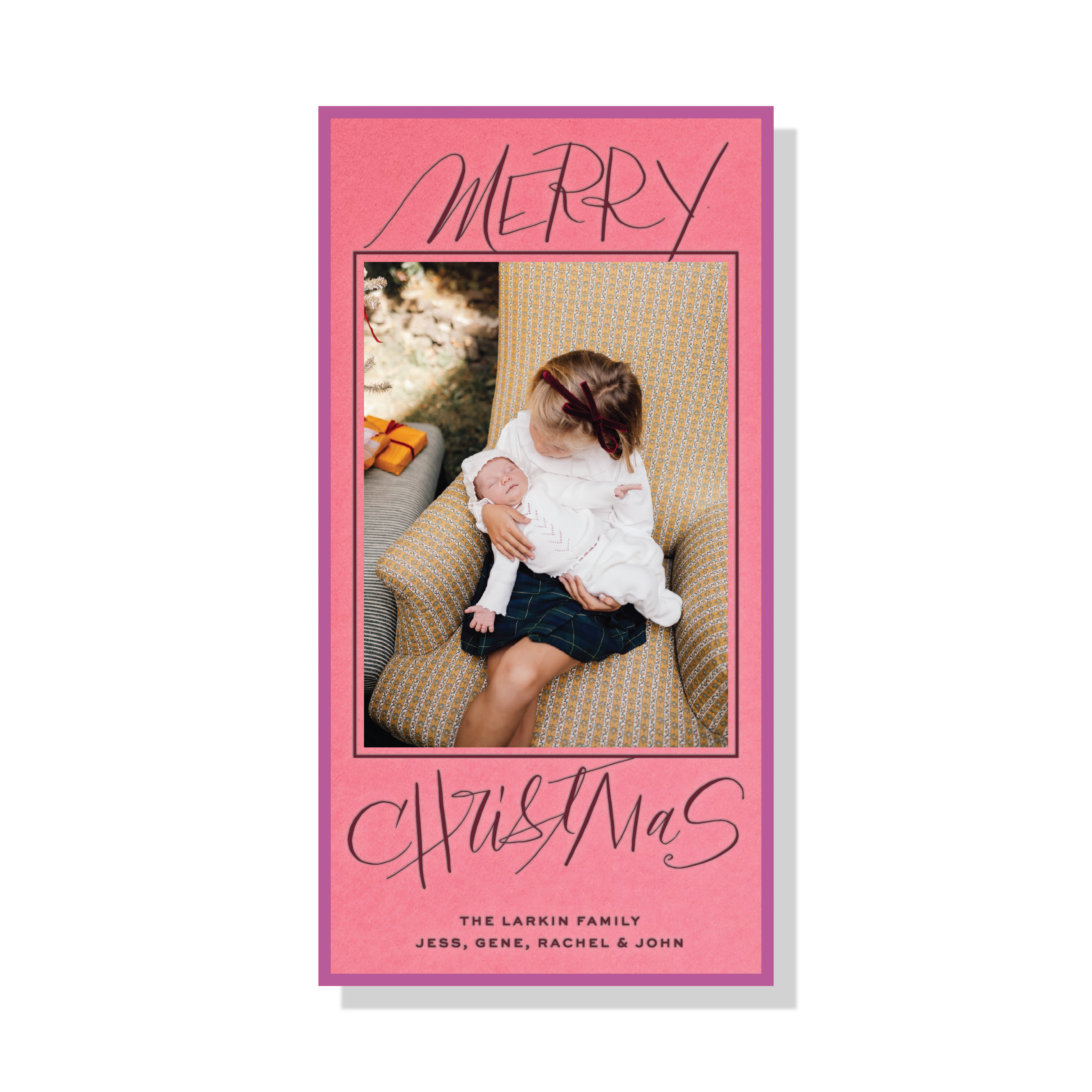 Larken Engraved Photo Holiday Card featuring a family photograph, sweeping “Merry Christmas” lettering, and elegant engraved details.