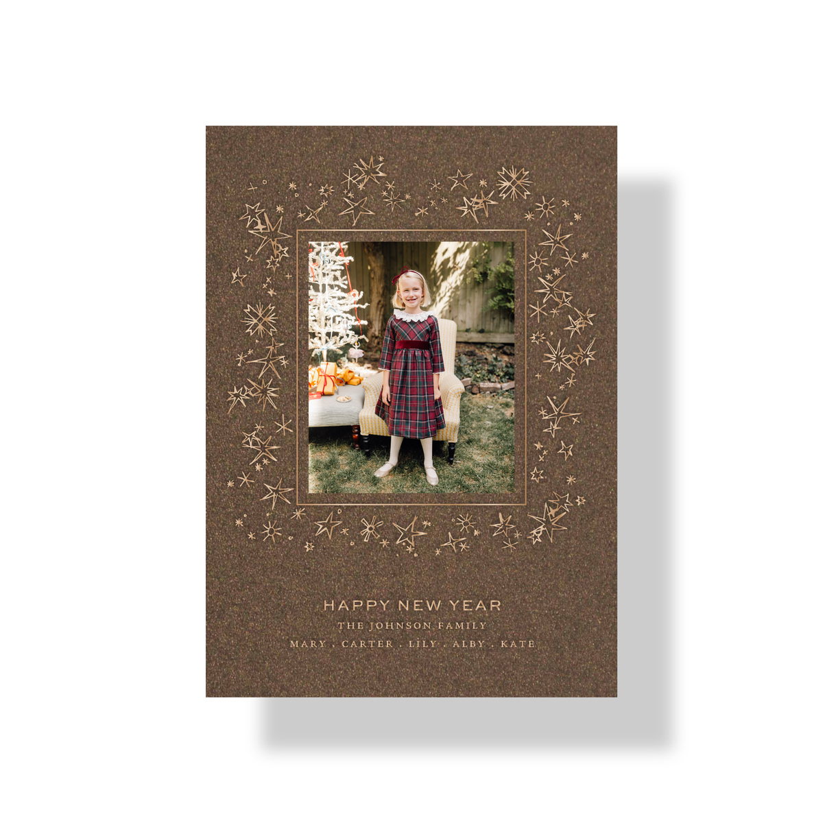 Leda engraved photo holiday card in bronze shimmer paper with metallic champagne ink and celestial star wreath artwork