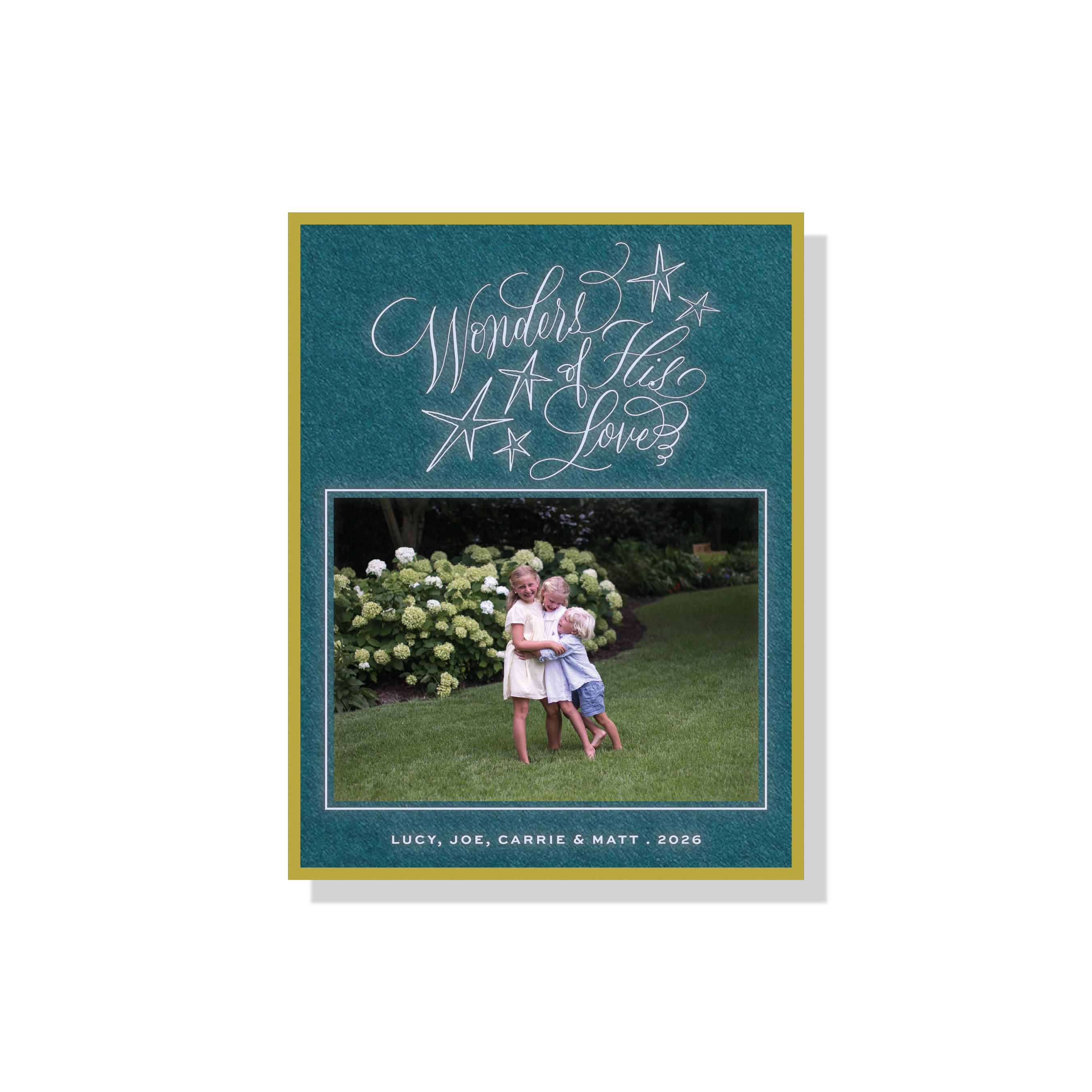 Merriweather Engraved Christmas Photo Card with a family portrait, flowing “Wonders of His Love” lettering, and traditional engraving.