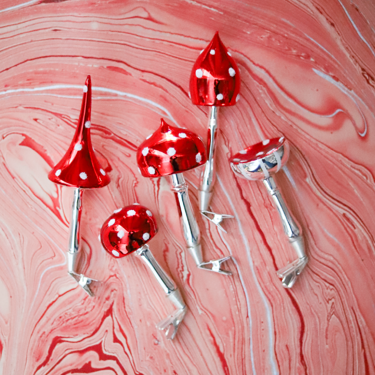 Made in Europe and blown and painted by hand, these glass mushroom clip ornaments bring old-world charm and storybook detail to the Christmas tree.