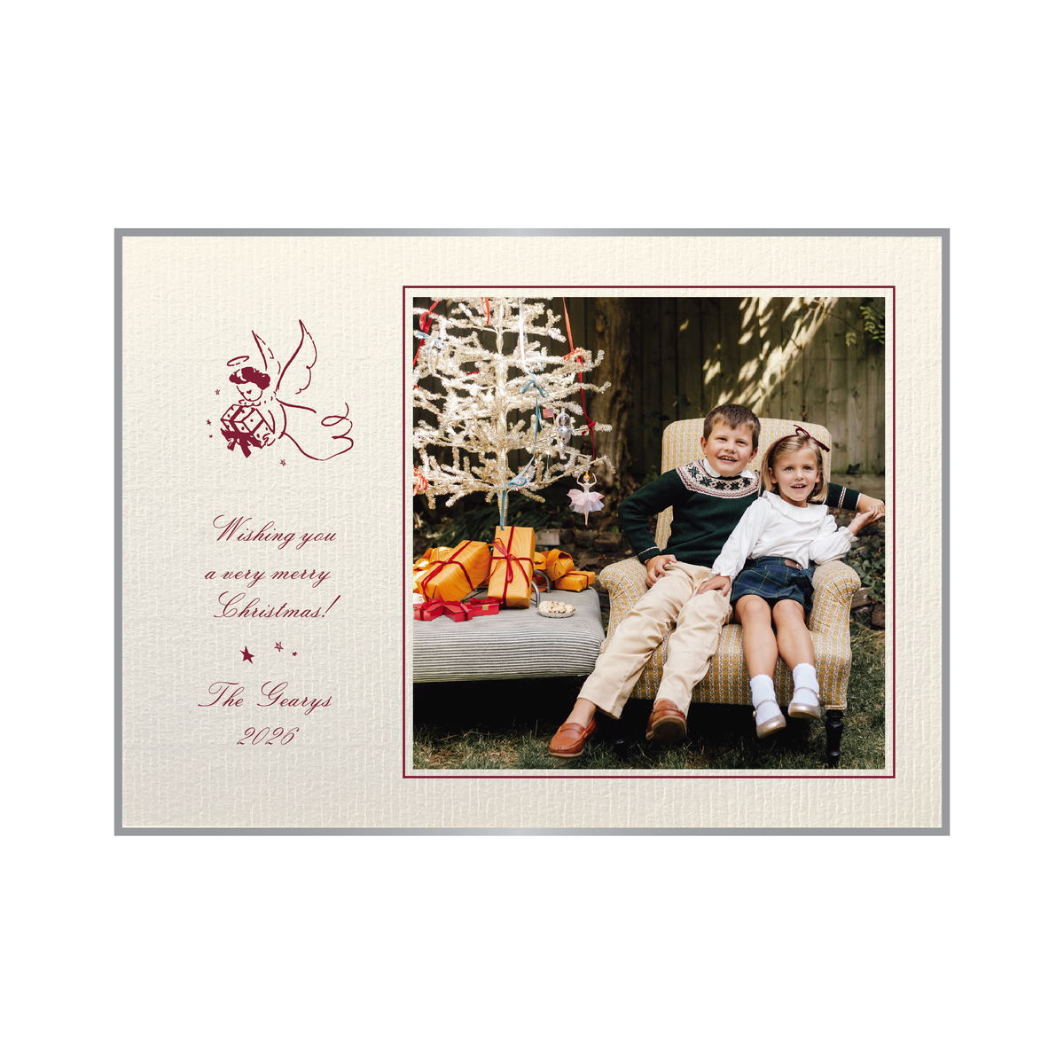The Sutton personalized photo Christmas card by Stovall Collection, featuring a vintage Christmas angel, classic script typography and a family photograph on creamy laid paper.