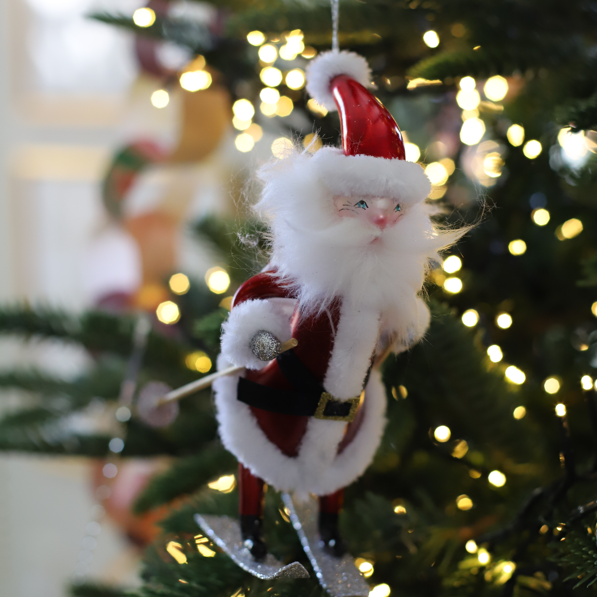 St. Moritz Skiing Santa Glass Ornament