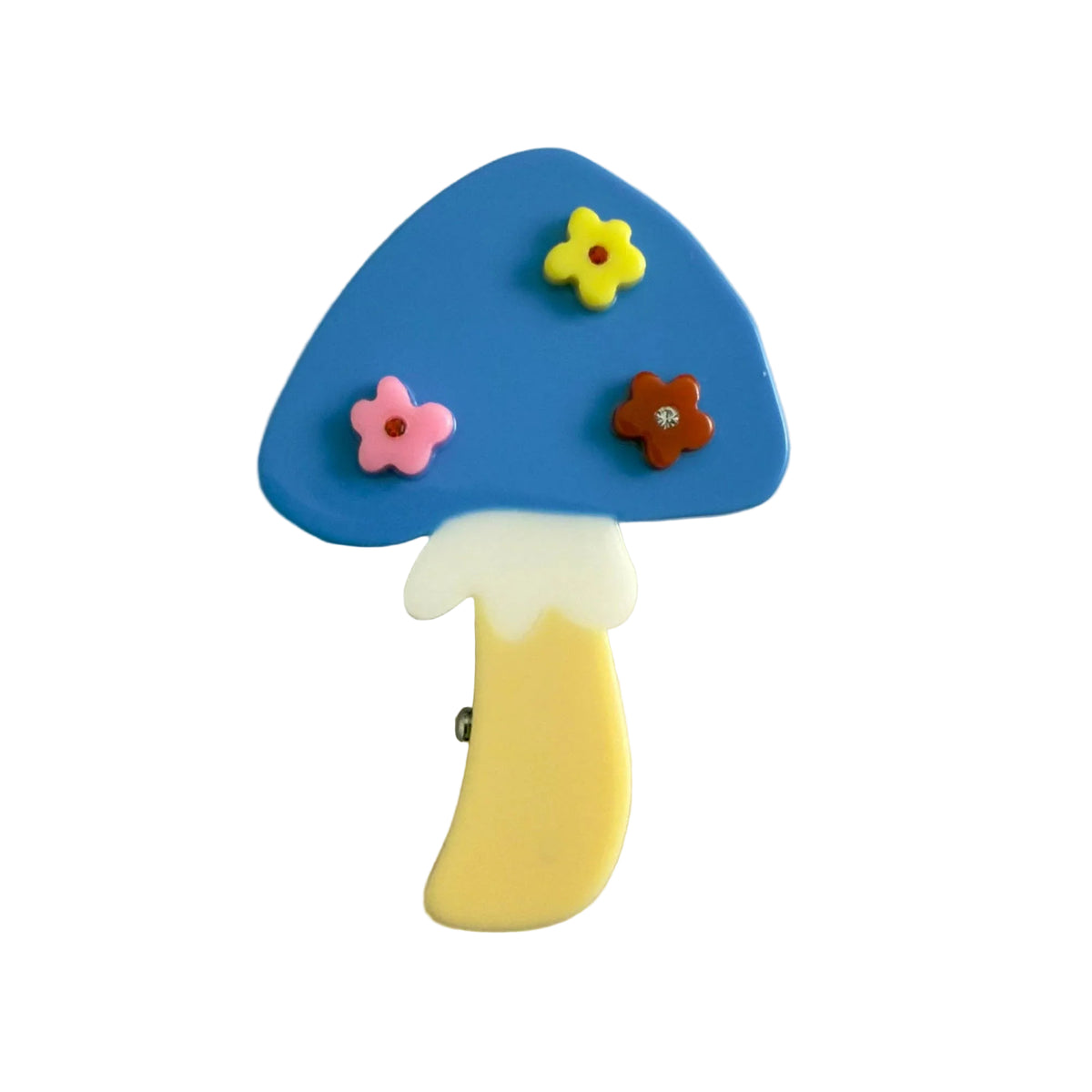 The Blue Flower Mushroom Hair Clip features a bright blue cap, colorful floral details and a yellow stem, handmade from cellulose acetate.