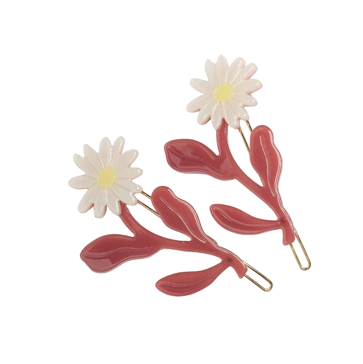 The Marguerite Daisy Barrette Set includes two floral cellulose acetate hair clips with ivory daisies, yellow centers and rose-colored leafy stems.