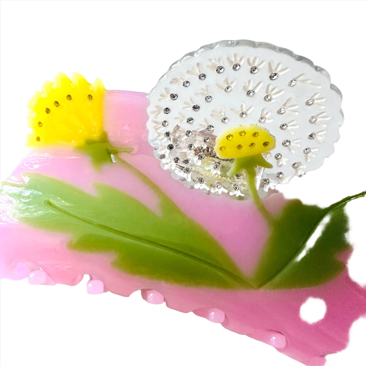 Add a playful botanical touch with the Dandelion Garden Hair Clip, crafted from colorful cellulose acetate with dimensional flowers and leafy details.