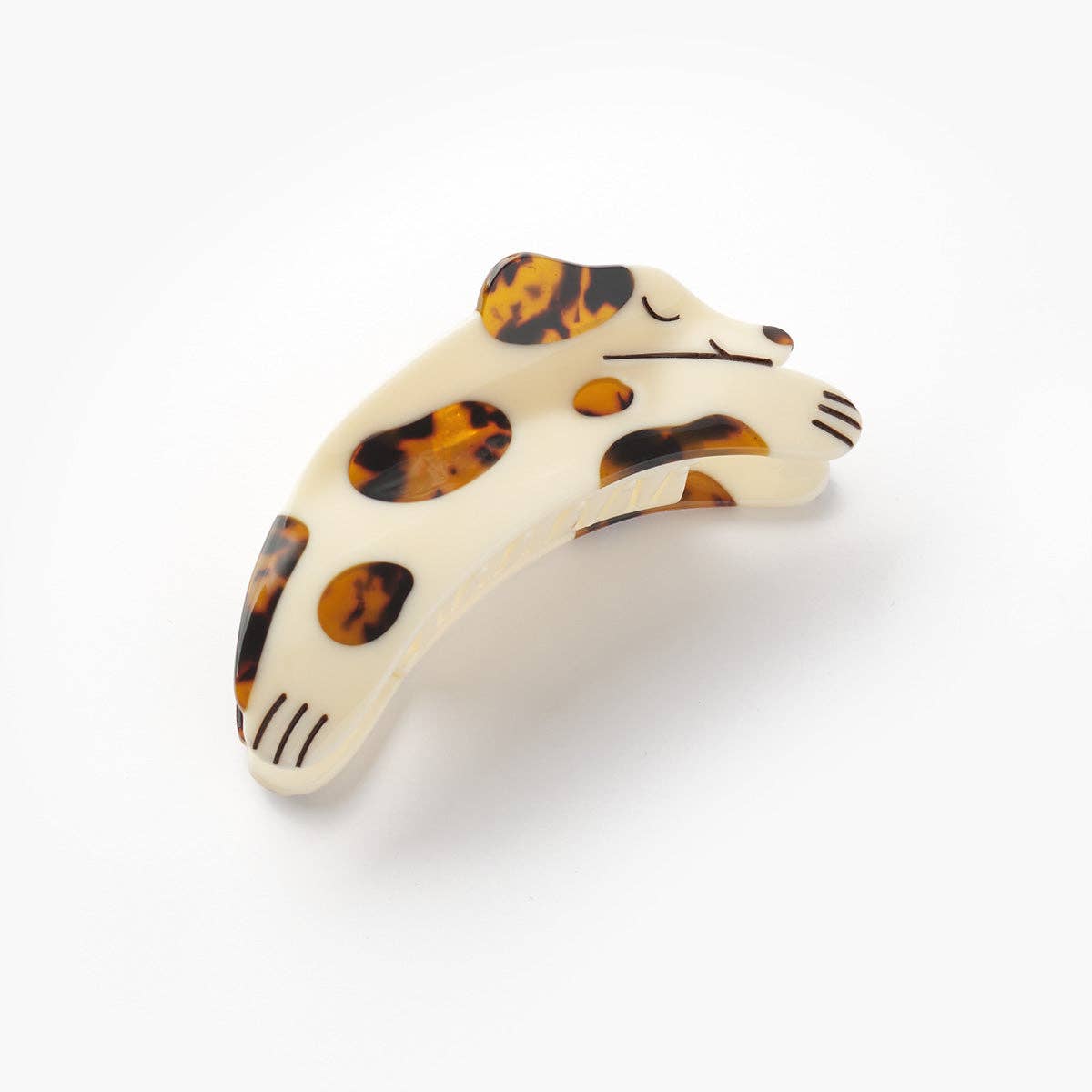 The Tortie Puppy Hair Claw features a playful dog shape with warm tortoise shell details, handcrafted from cellulose acetate with hand-painted accents.