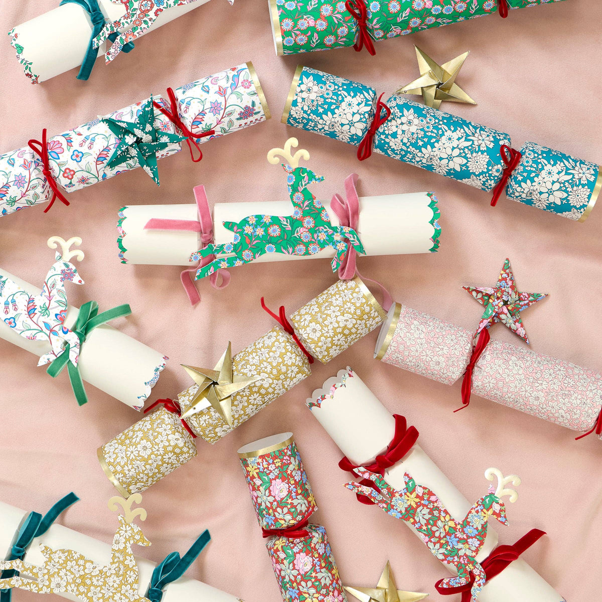 Liberty print Christmas crackers with gold origami star ornaments