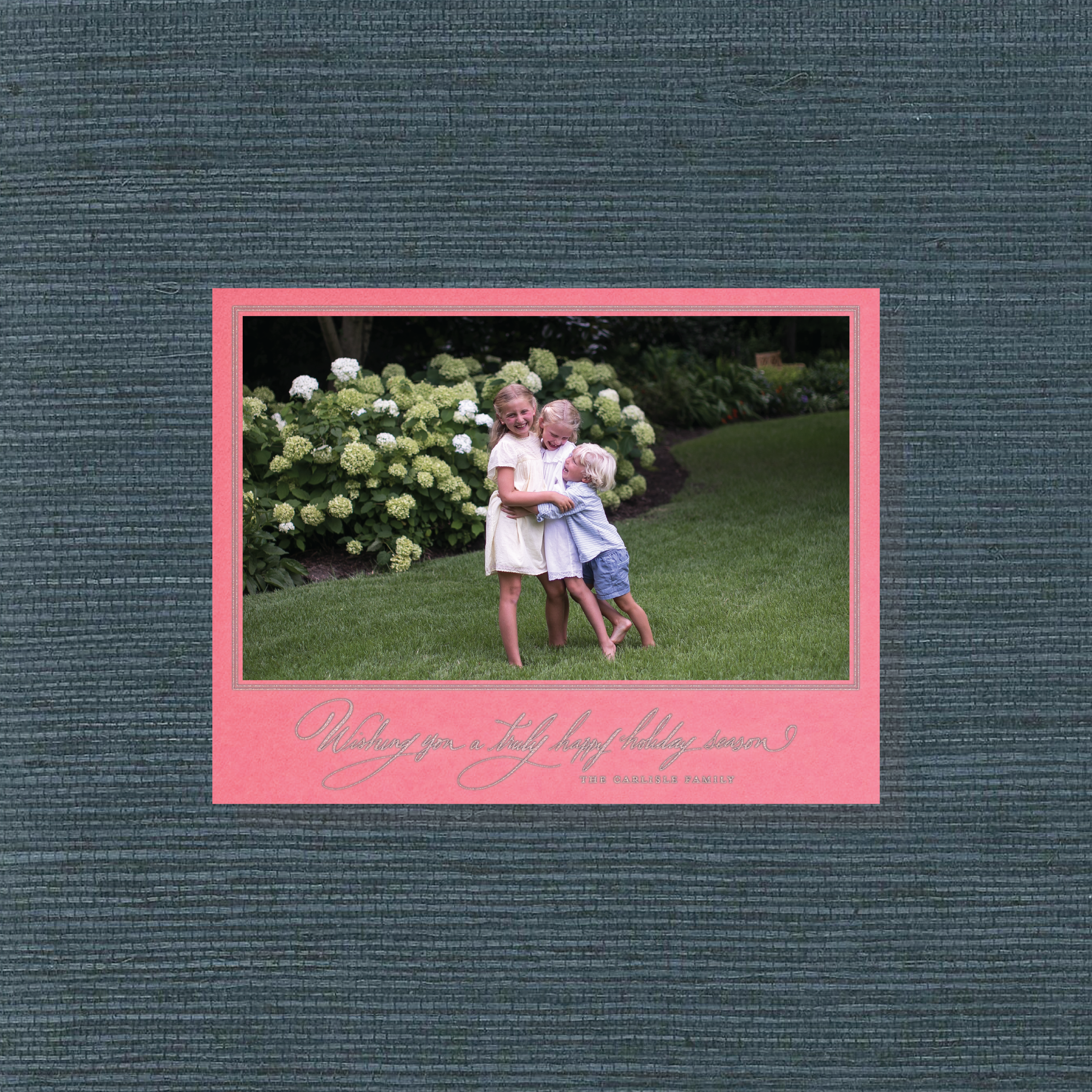 Carlisle Engraved Christmas Photo Card with elegant hand-lettered calligraphy, a personalized family photo, and crisp, raised engraved details.