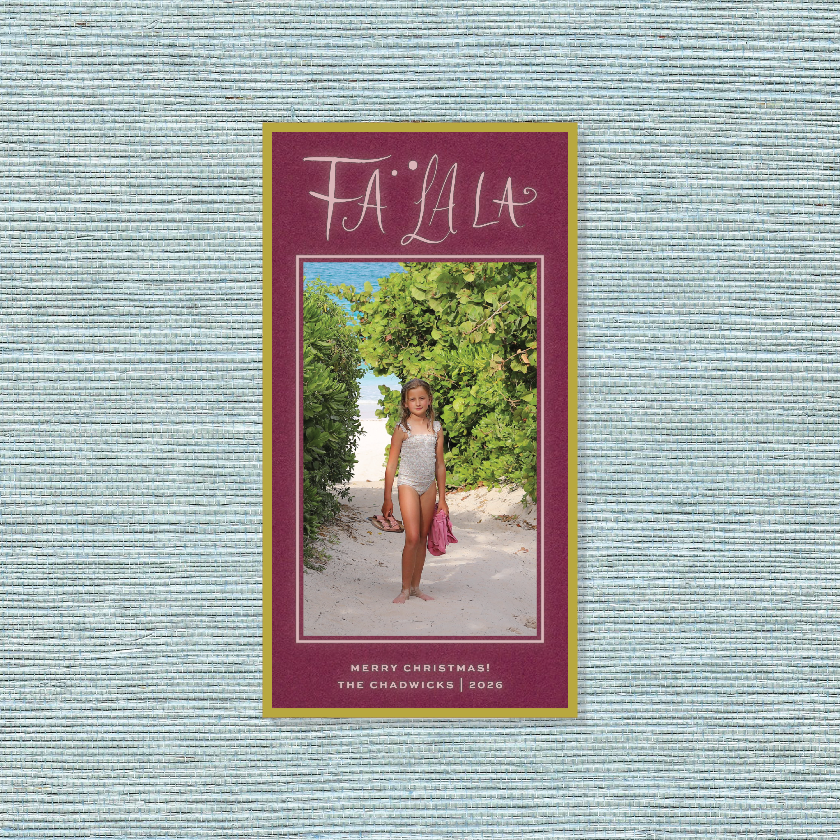 Chadwick Engraved Photo Christmas Card featuring a vertical family photograph, playful “Fa La La” lettering, personalized wording, and traditional engraving.