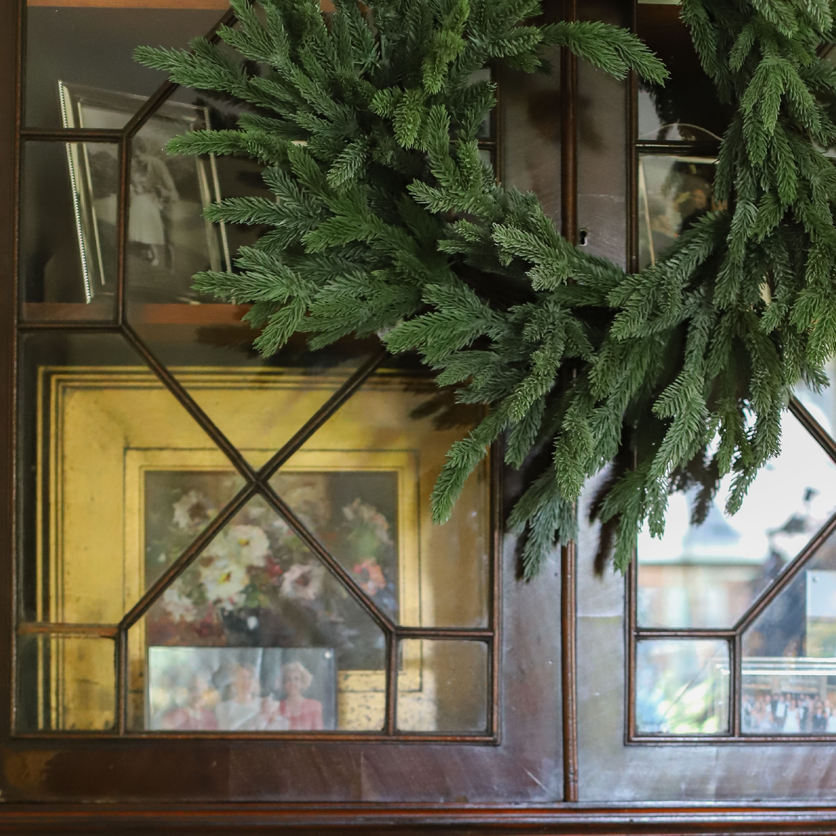Cotswold Fir Wreath displayed on an antique mirror for classic Christmas decor