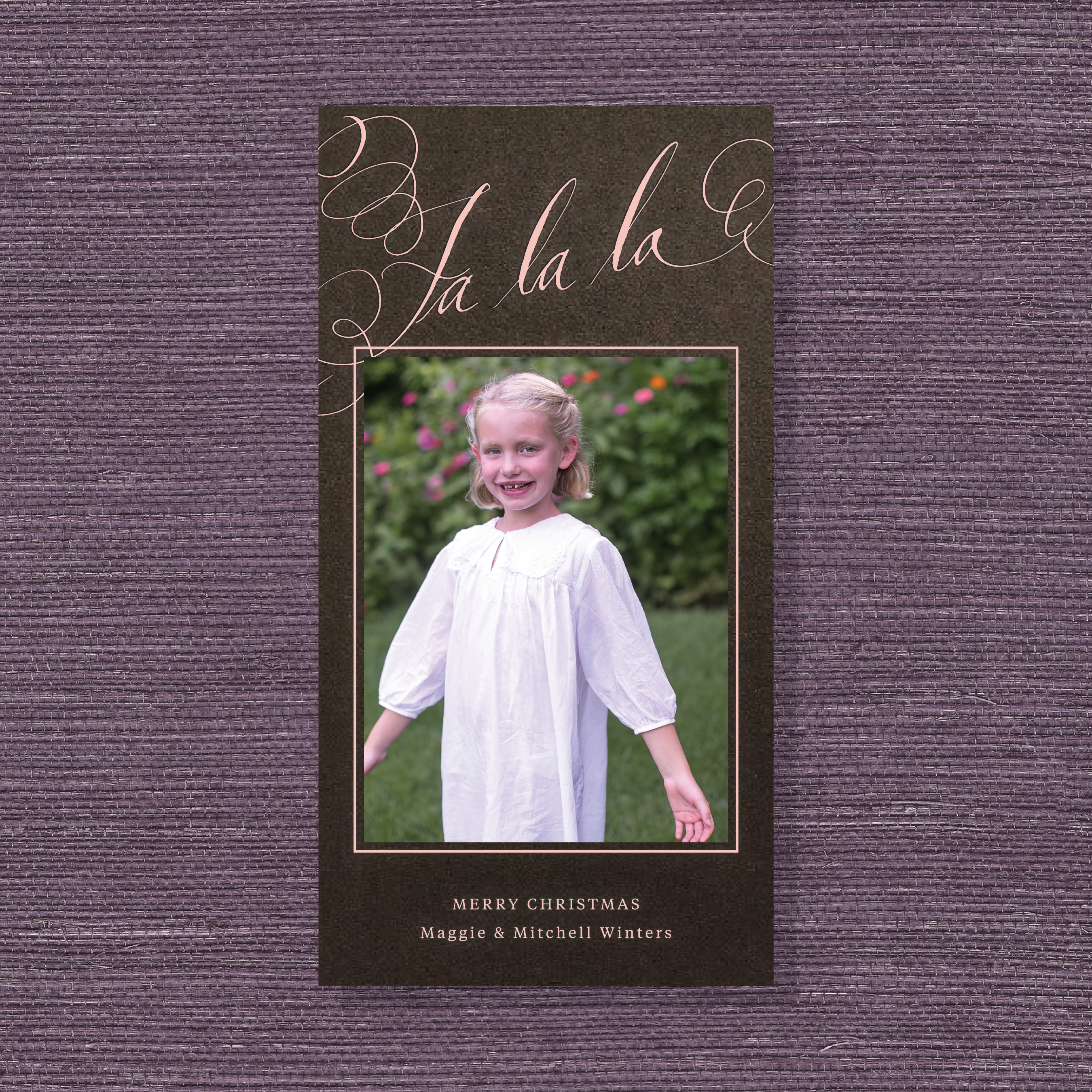 Farnley Engraved Christmas Photo Card with a family photograph, expressive pen-and-ink “Fa La La” calligraphy, and raised engraving.