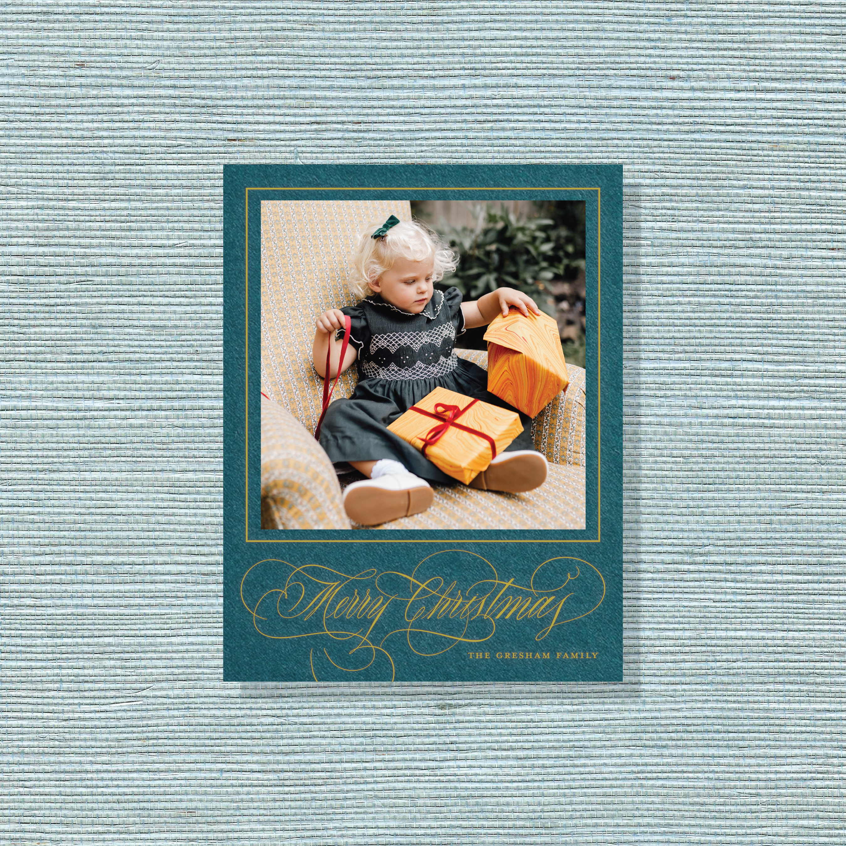 Gresham Engraved Christmas Photo Card with a child’s portrait, elegant hand-lettered “Merry Christmas” flourishes, and traditional engraving.