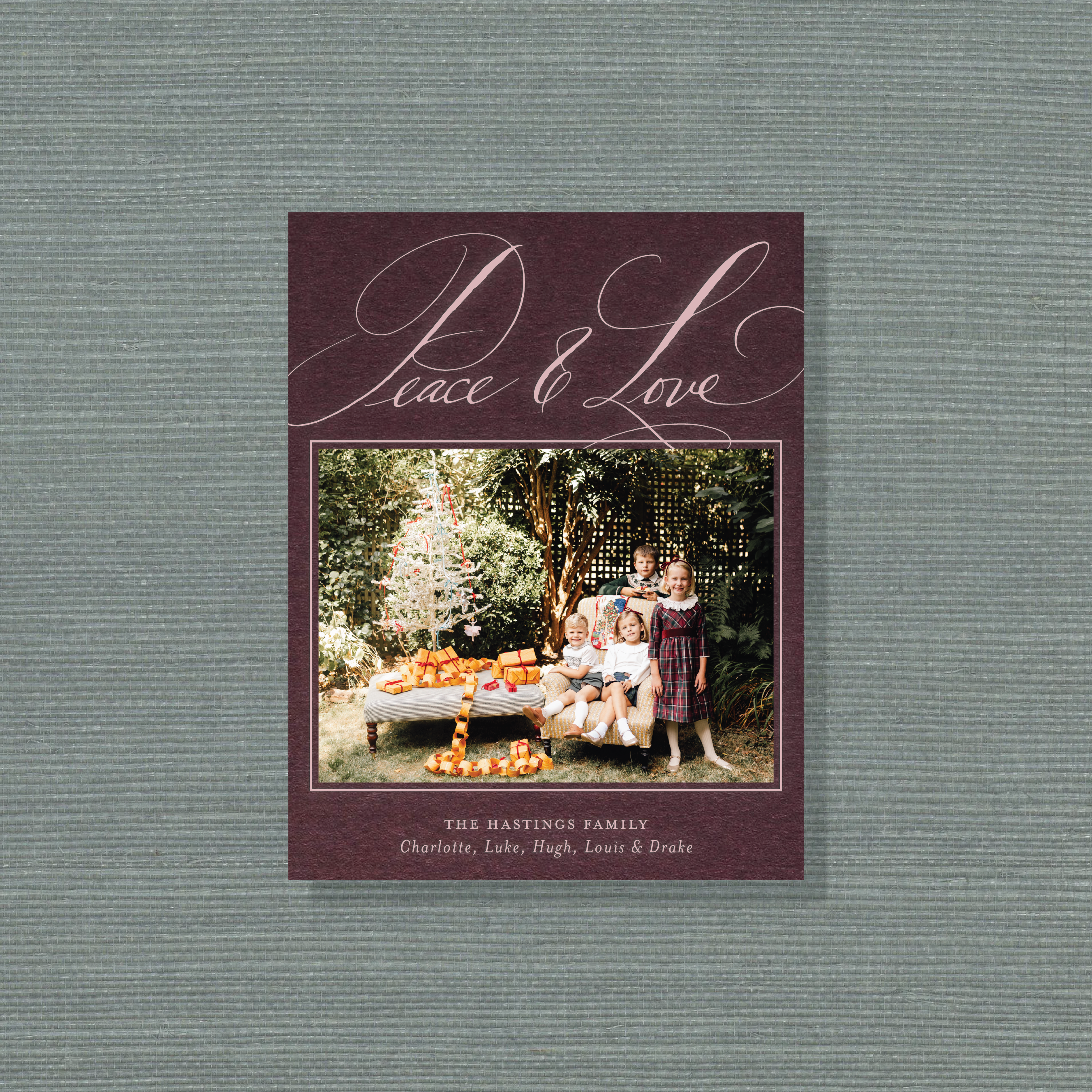 Personalized Hastings Engraved Holiday Card featuring a family photograph and graceful pen-and-ink “Peace & Love” lettering
