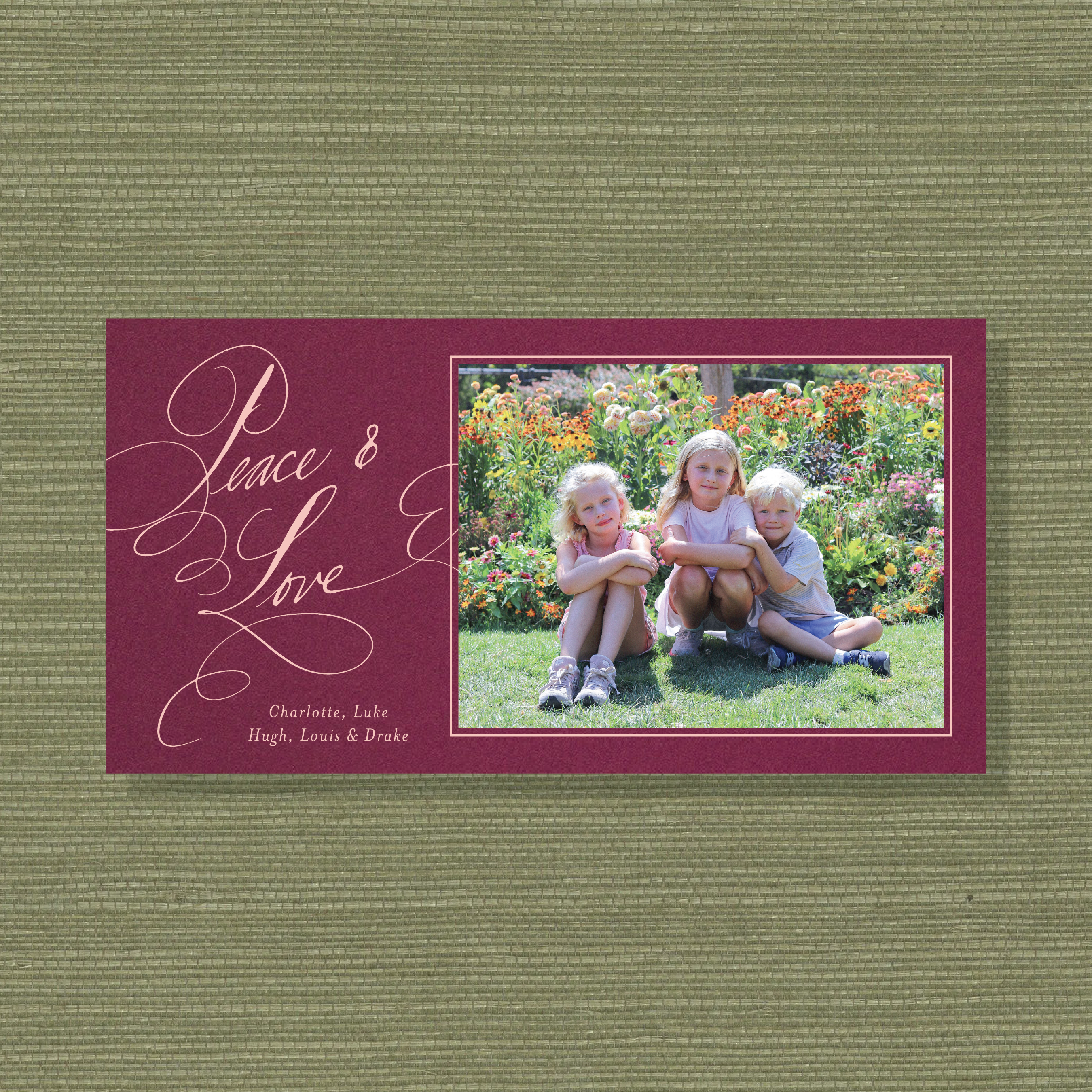 Personalized Hastings Engraved Holiday Card featuring a family photograph and graceful pen-and-ink “Peace & Love” lettering.