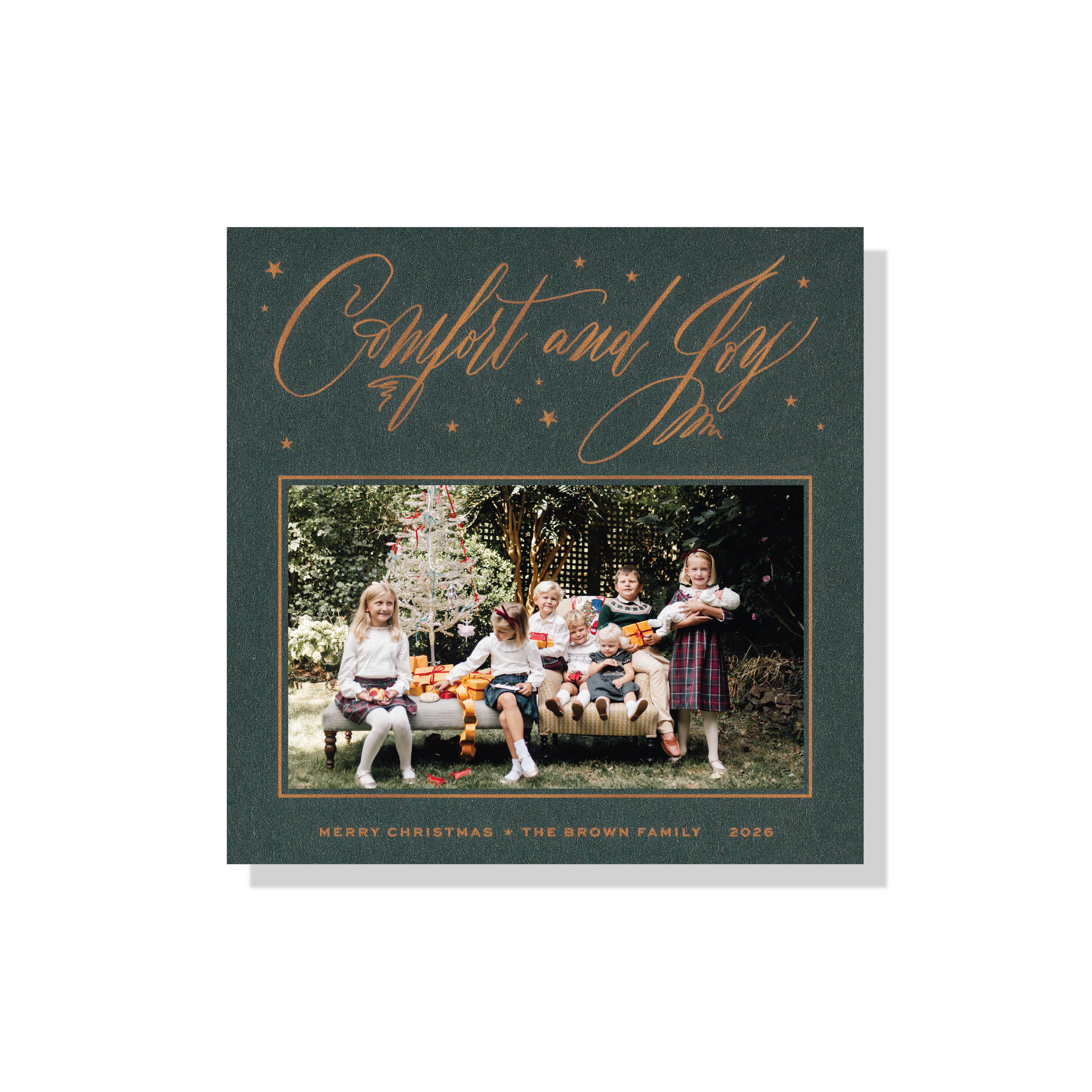 Hawthorne Engraved Christmas Photo Card with a family portrait, sweeping “Comfort and Joy” lettering, and crisp raised engraved details.
