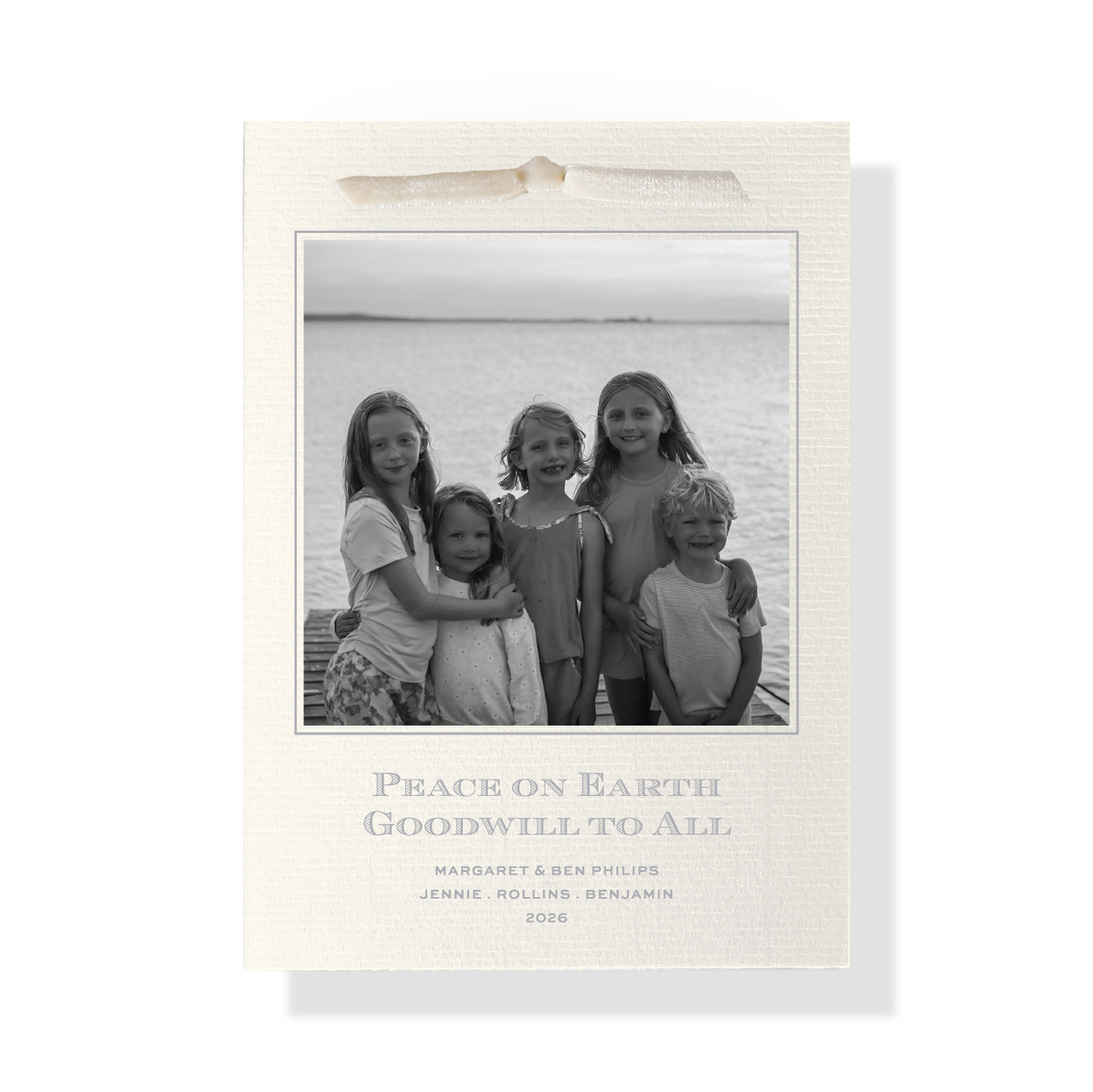 Heath Velvet Ribbon Classic Print Holiday Card with black and white family photo, soft blue typography and ivory velvet ribbon