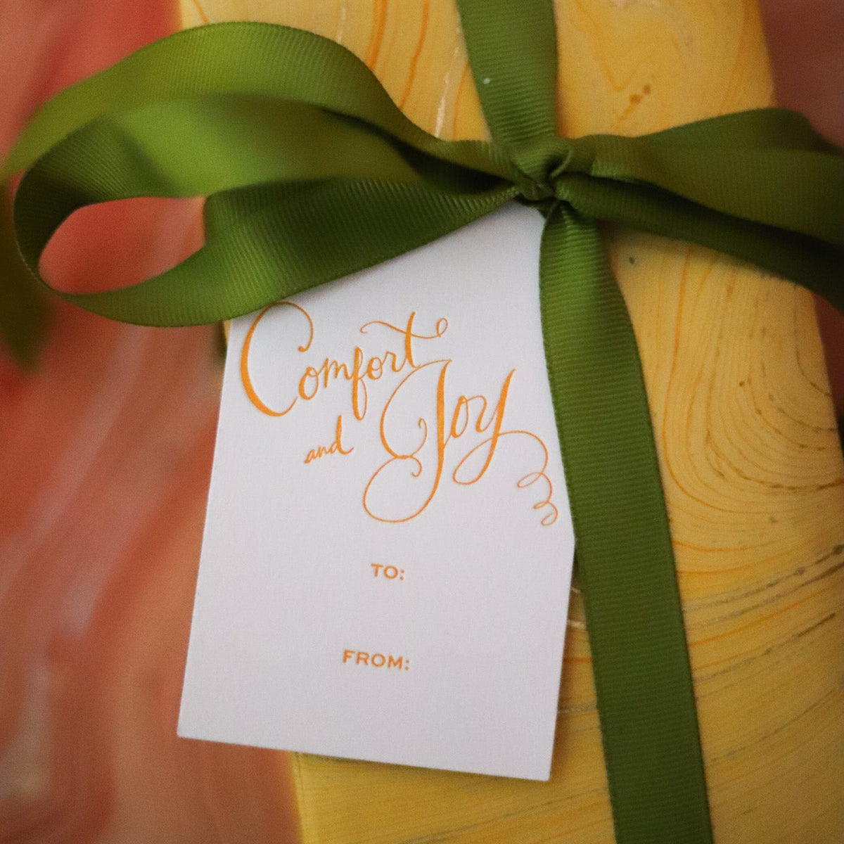 Shop Comfort & Joy Gift Tags in sets of 8, featuring hand-lettered lettering, To and From lines, and coordinating colors for festive Christmas wrapping.