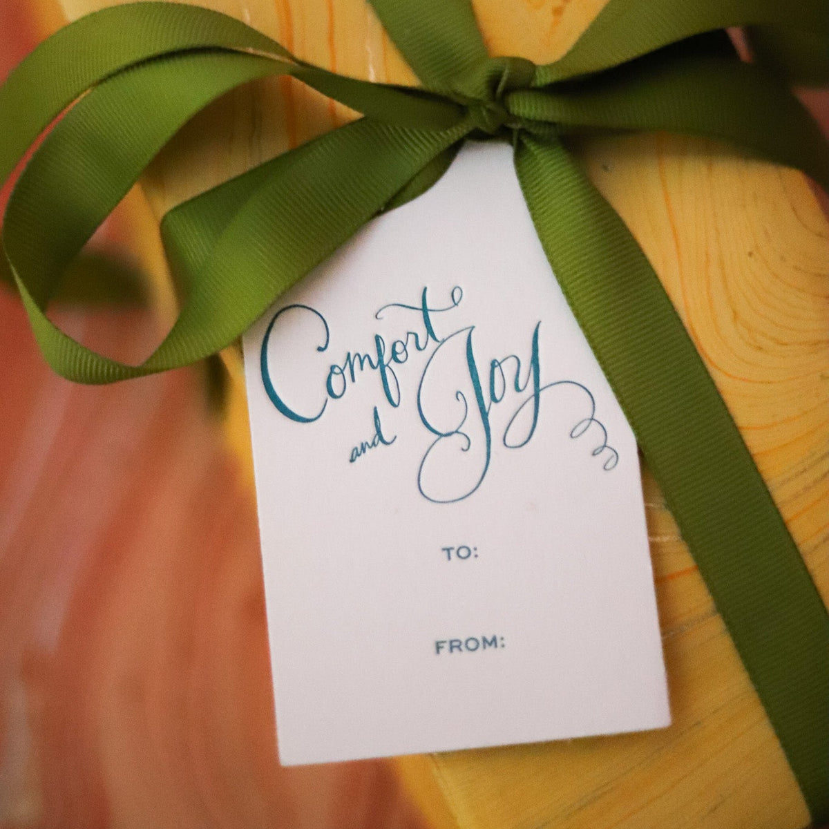 Shop Comfort & Joy Gift Tags in sets of 8, featuring hand-lettered lettering, To and From lines, and coordinating colors for festive Christmas wrapping.