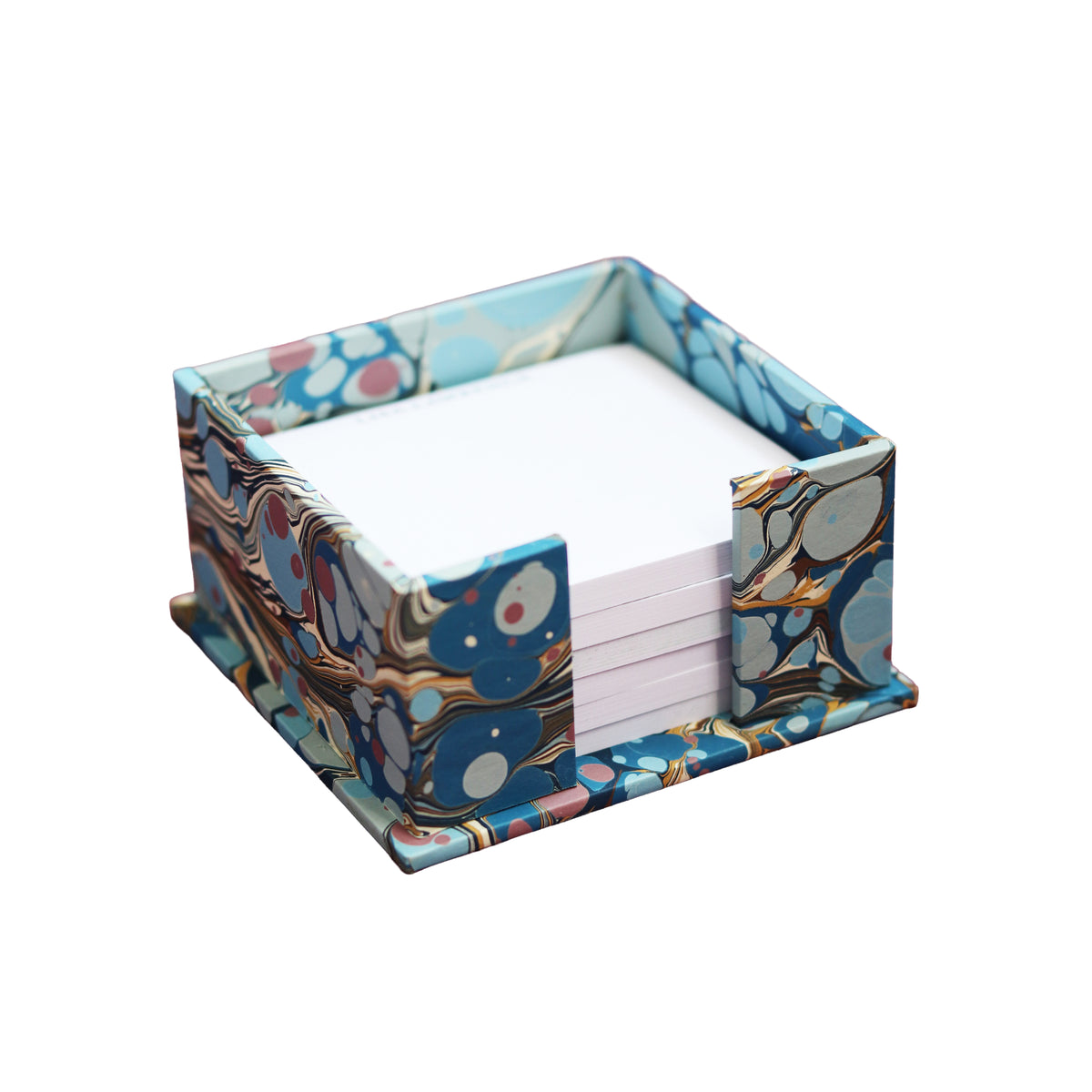 A square notepad holder with a blue, gold, and white marbled pattern, holding a stack of white notepads, shown on a solid white background.