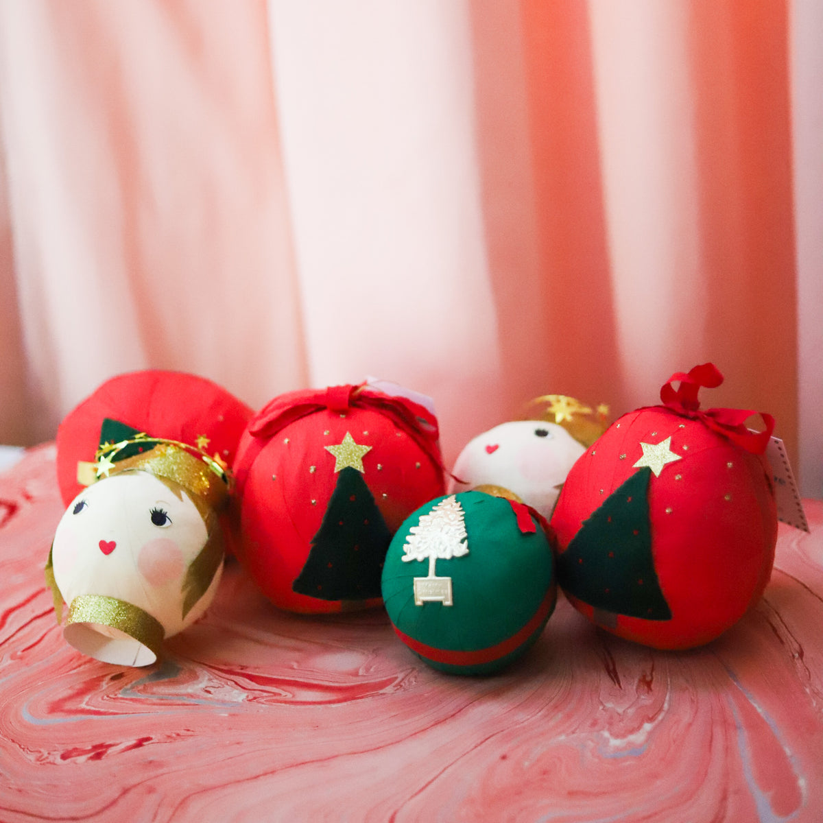 Assorted vintage-inspired Christmas Surprise Balls in red and green holiday designs