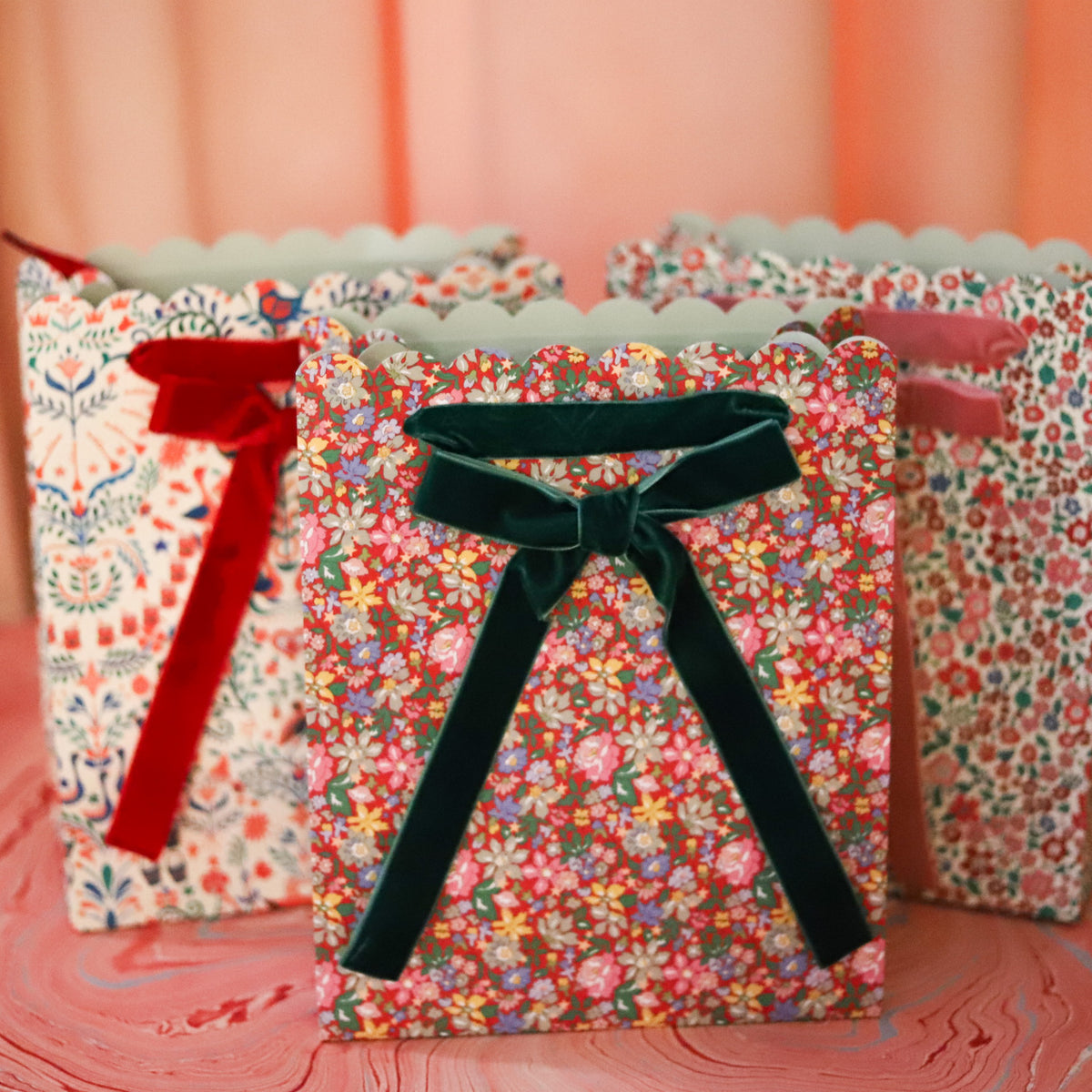 Make holiday gifting feel extra special with this set of three Liberty print gift bags, each featuring a different festive floral pattern in beautifully layered seasonal colors. 