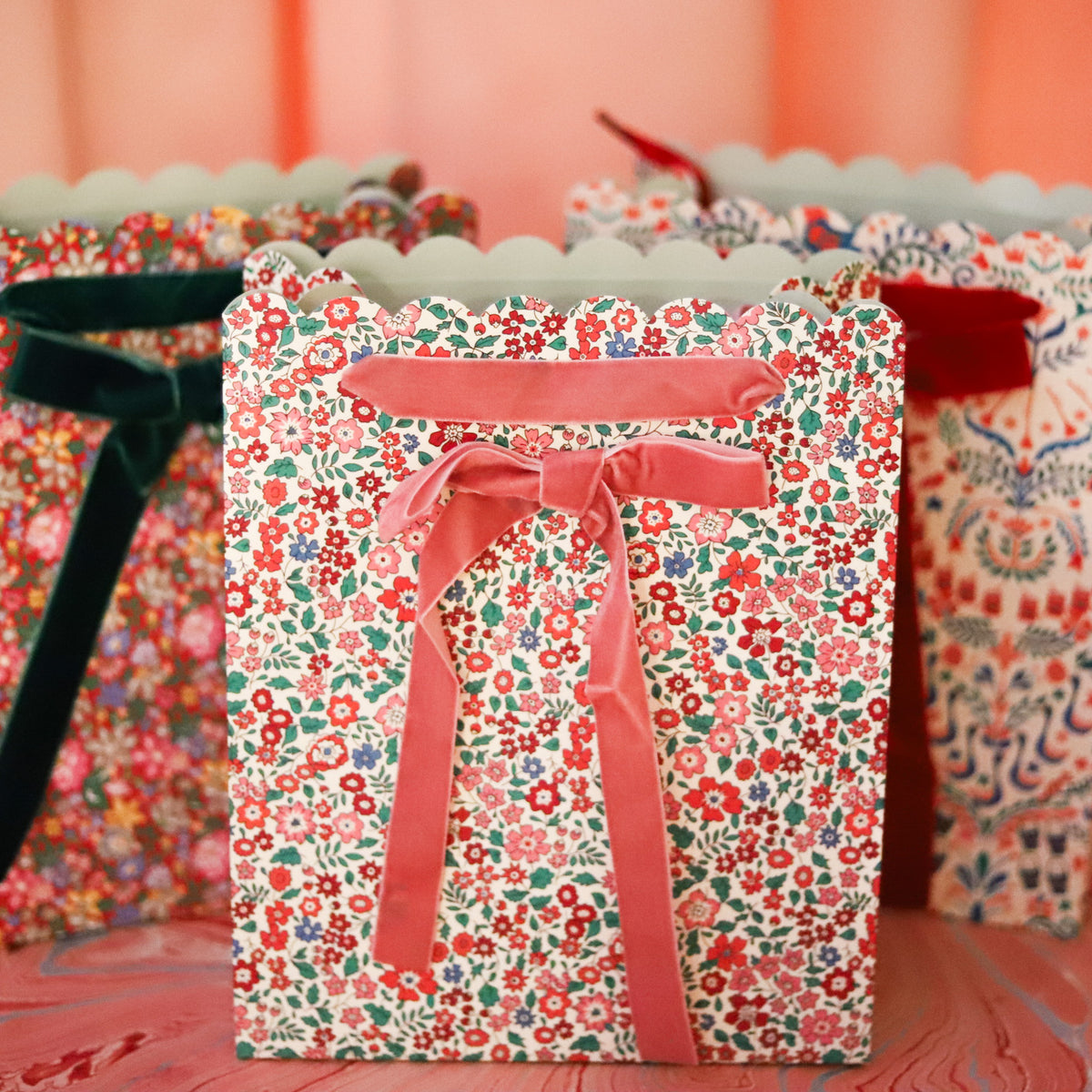 Make holiday gifting feel extra special with this set of three Liberty print gift bags, each featuring a different festive floral pattern in beautifully layered seasonal colors. 