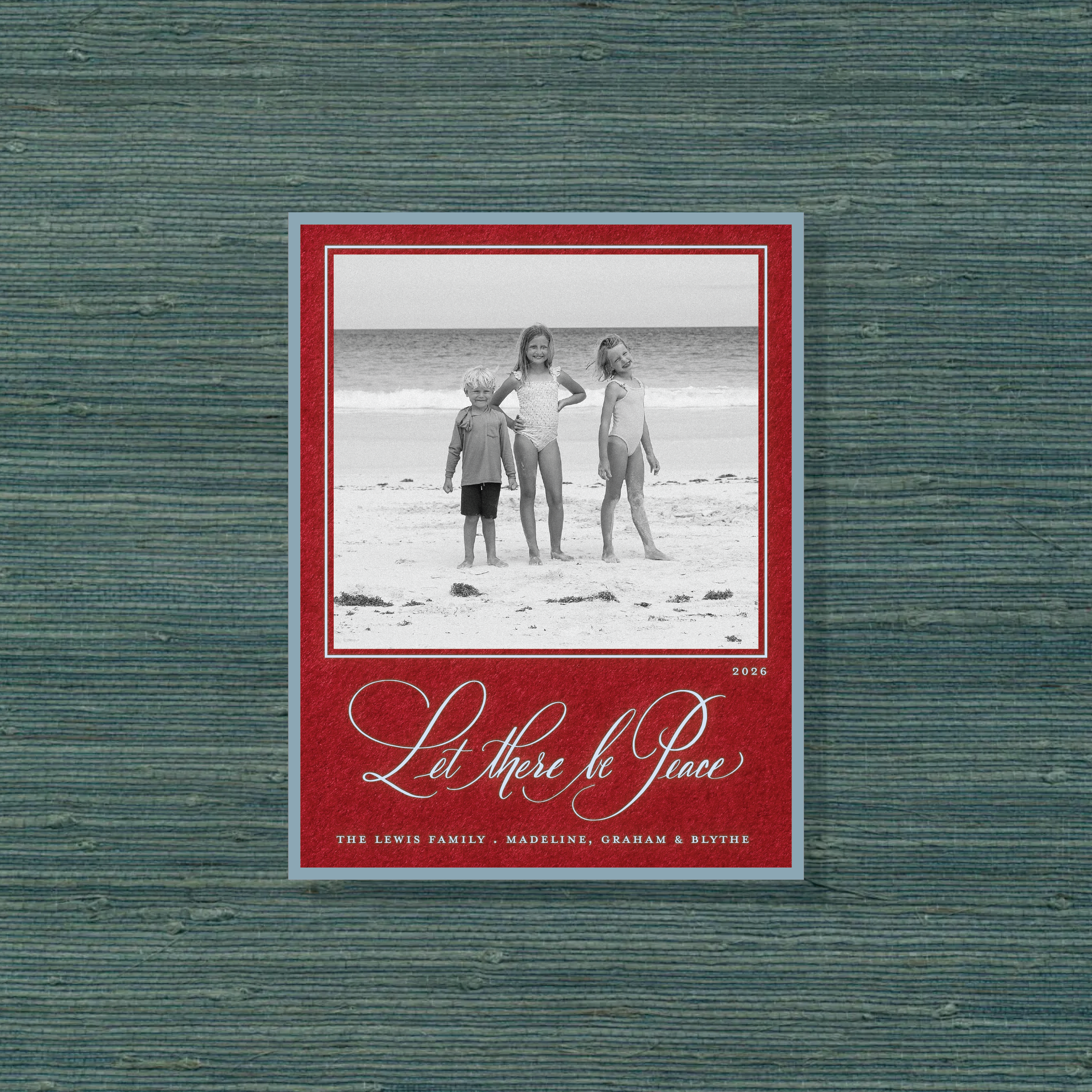 Lewis Engraved Christmas Photo Card with a family portrait, expressive “Let There Be Peace” calligraphy, and crisp raised engraving.