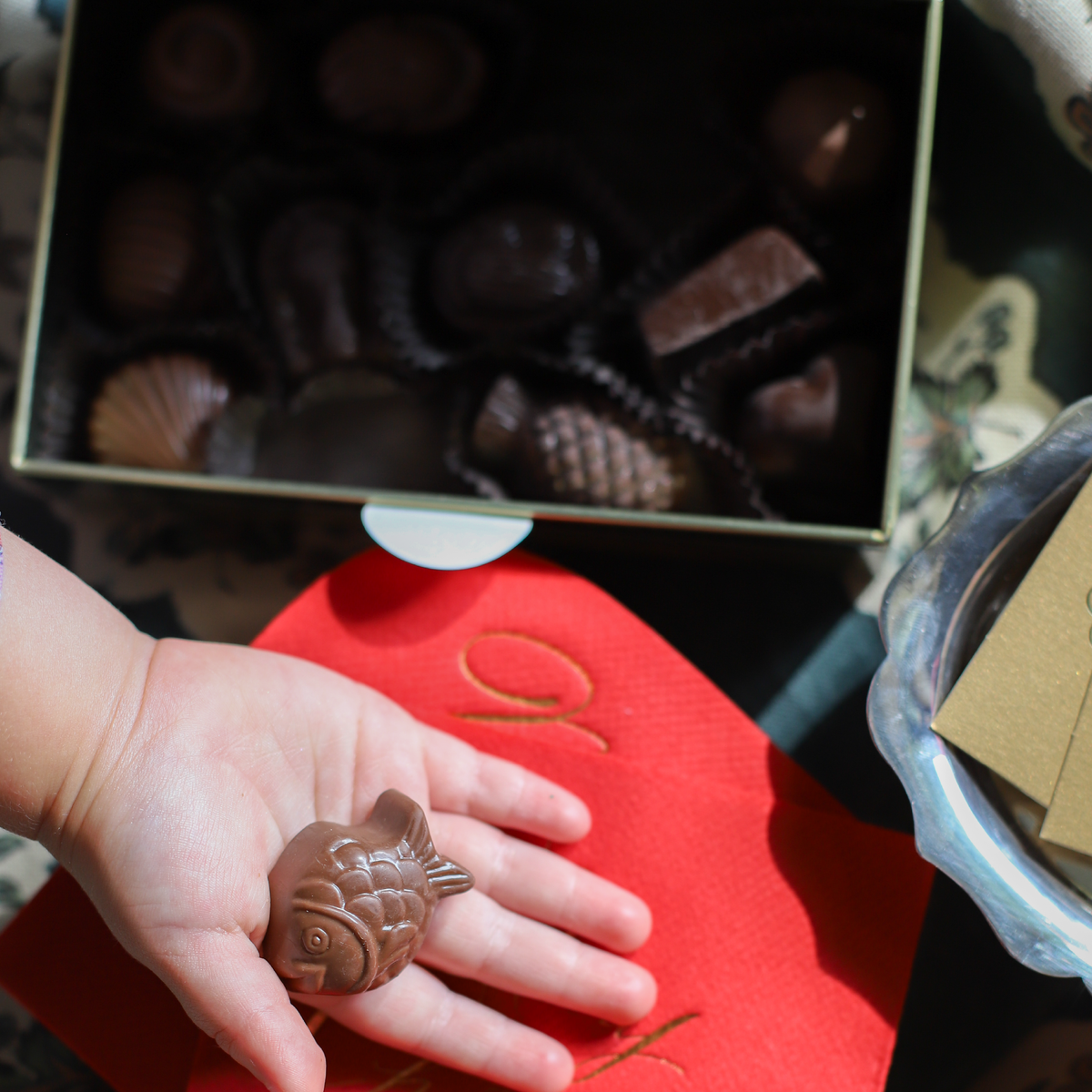Red Louis Sherry keepsake tin filled with assorted chocolates