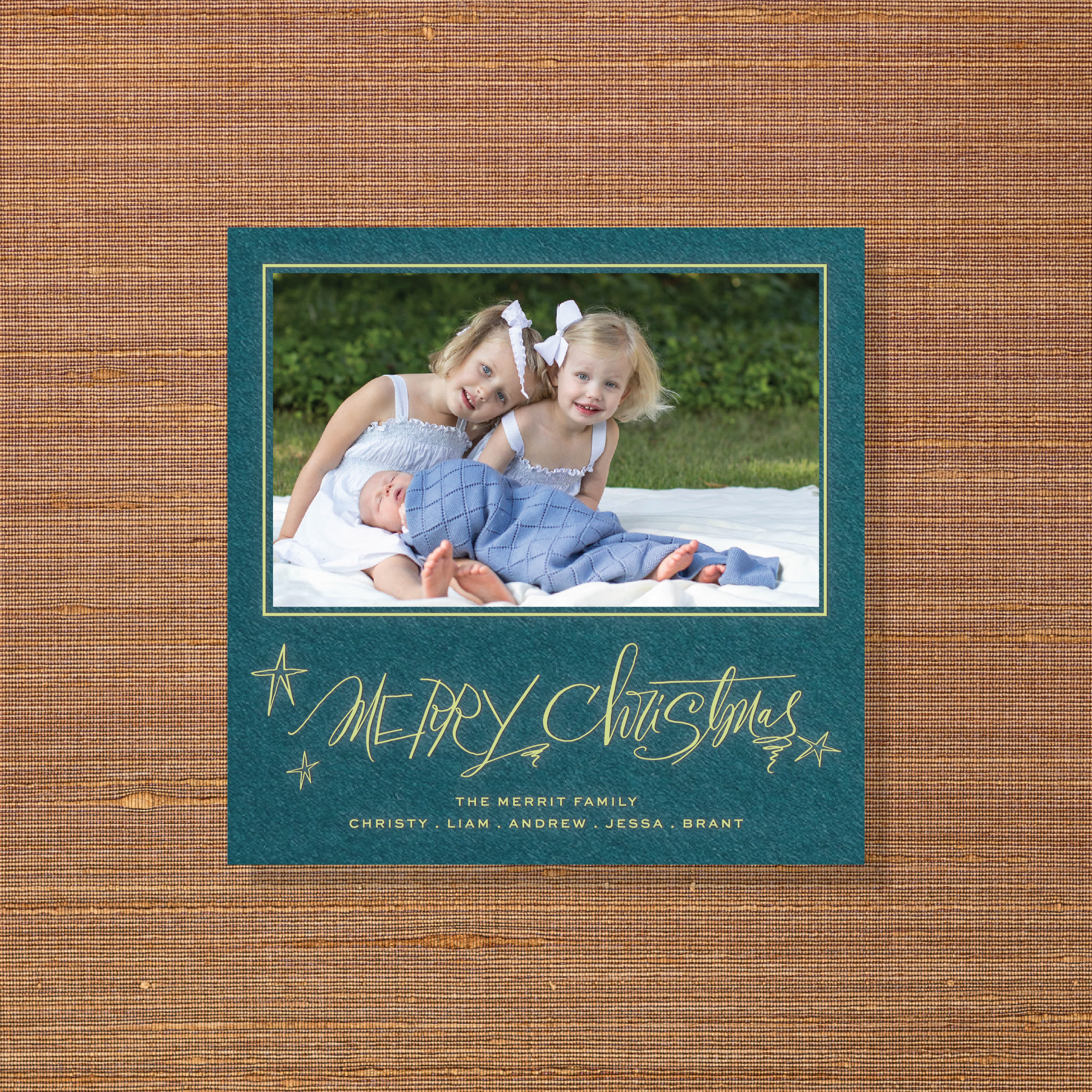 Merritt Engraved Holiday Card featuring sweeping hand-lettered “Merry Christmas” calligraphy, a favorite family photograph, and traditional engraving.