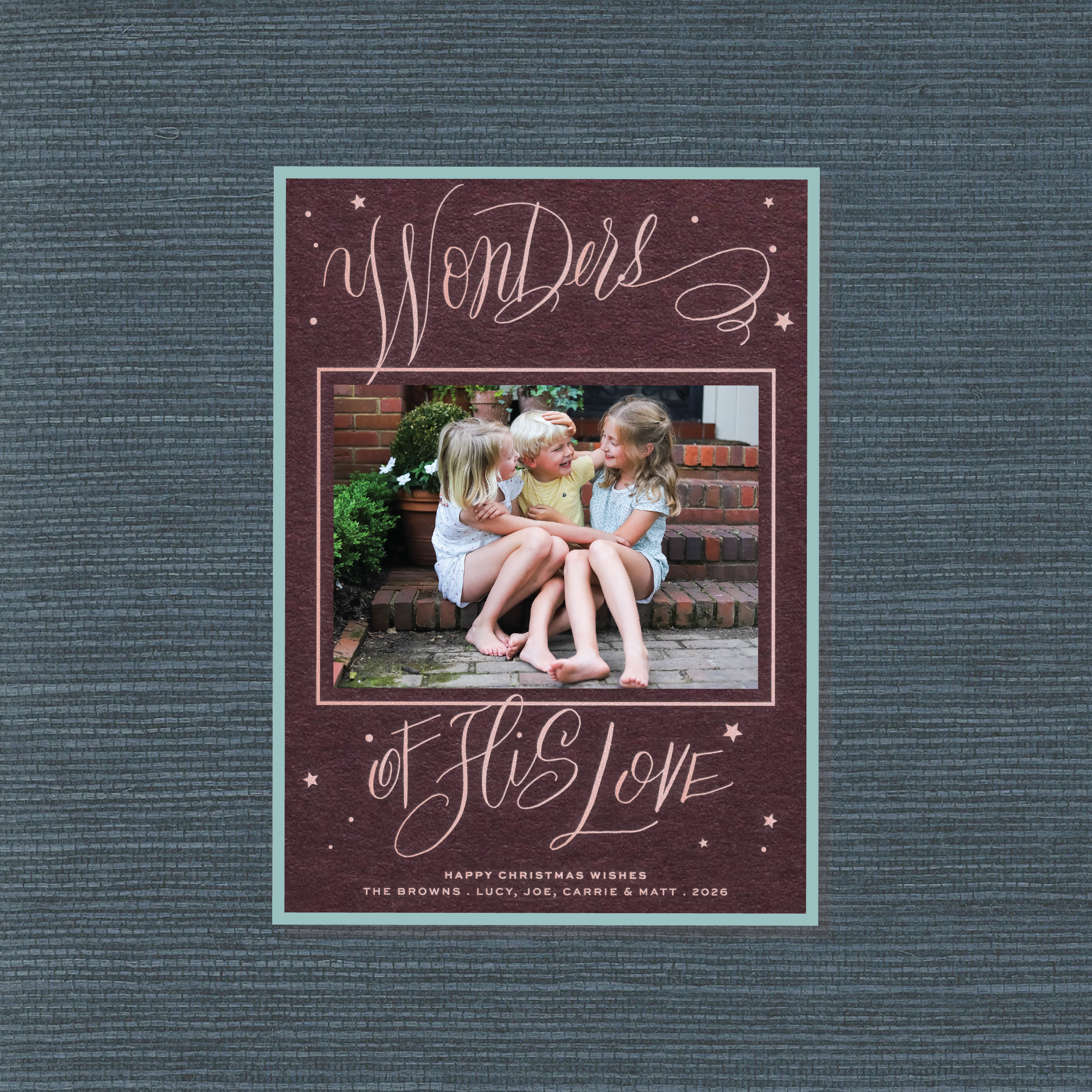 Merriweather Engraved Holiday Card featuring hand-lettered “Wonders of His Love” calligraphy around a favorite family photograph.