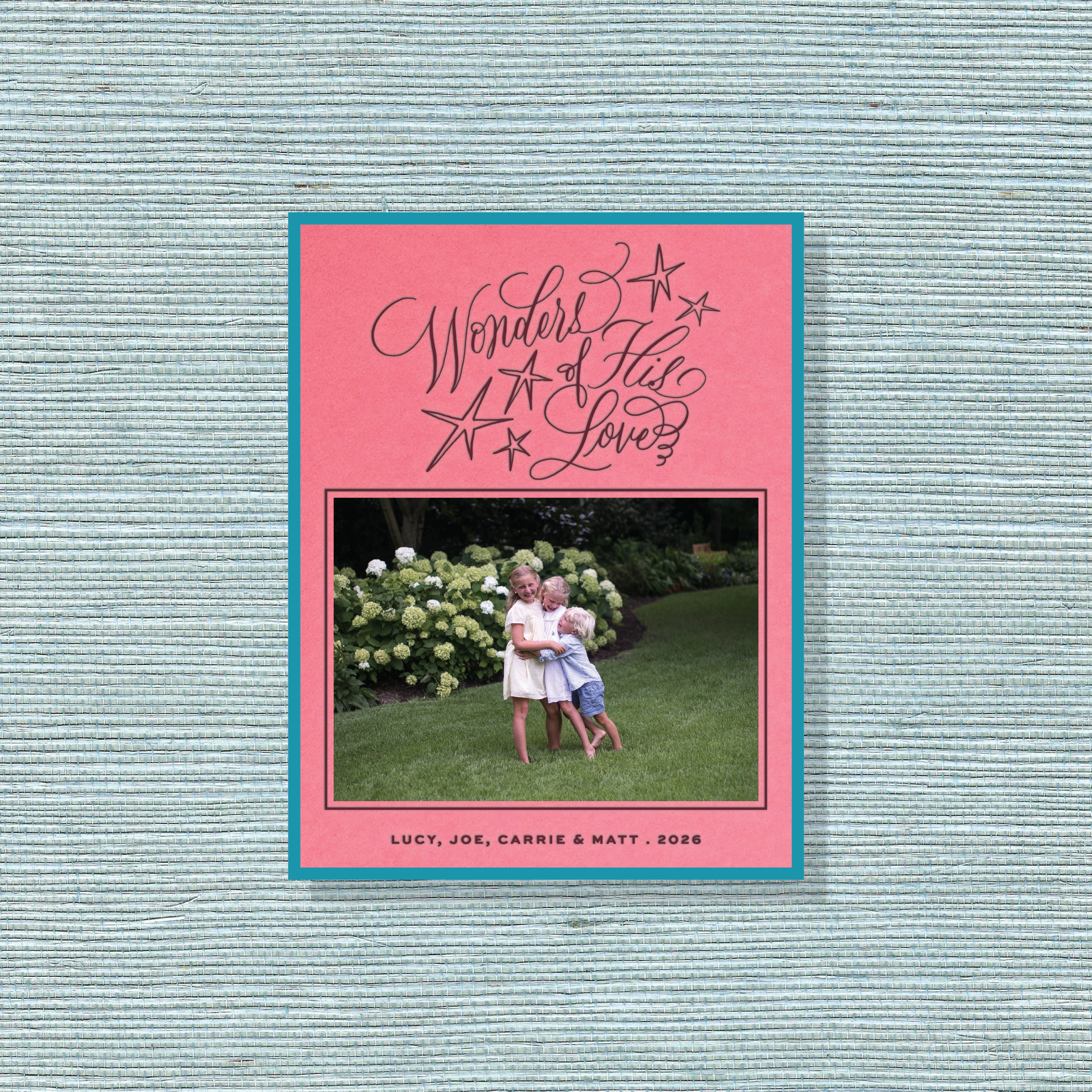 Merriweather Engraved Christmas Photo Card with a family portrait, flowing “Wonders of His Love” lettering, and traditional engraving.