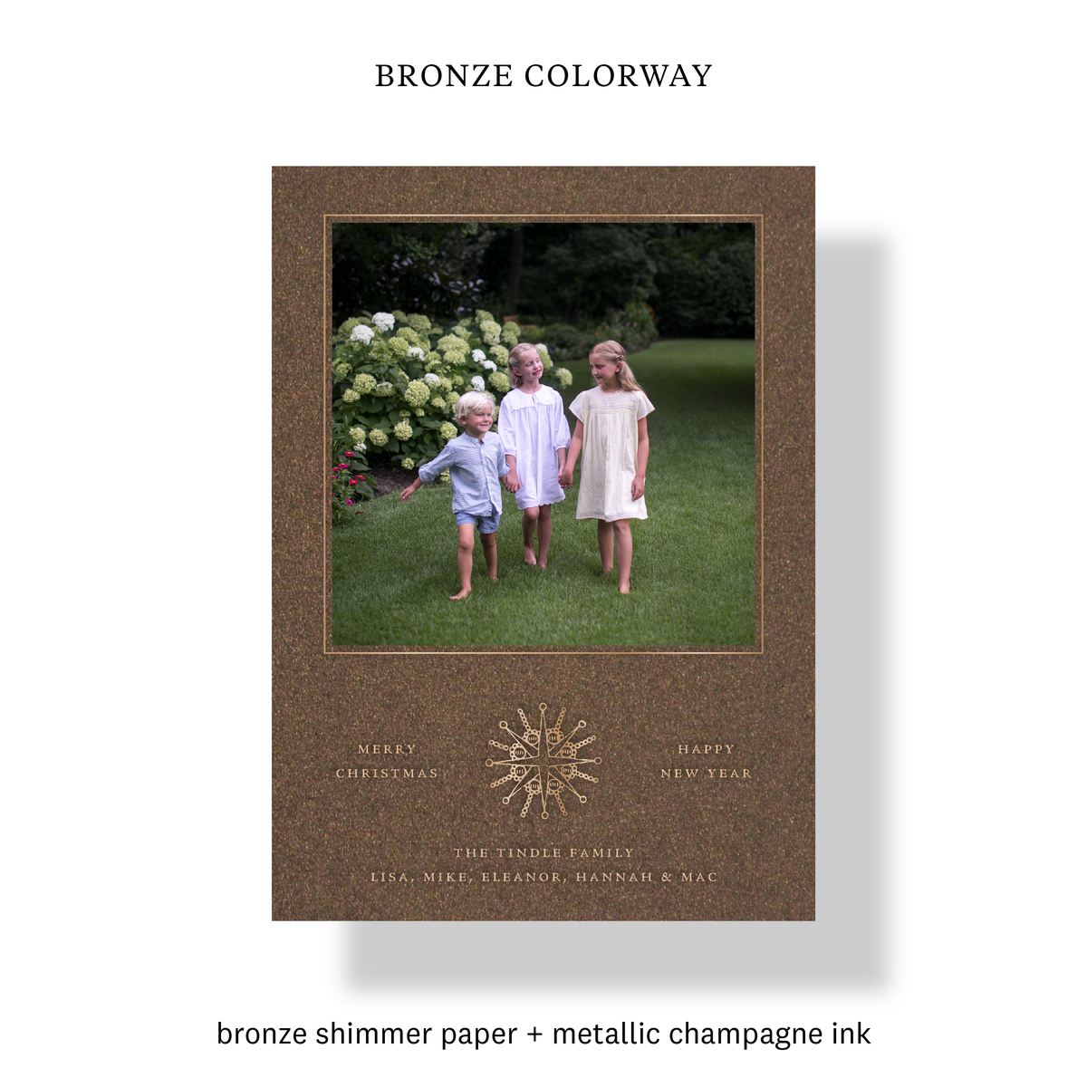 Bronze colorway of the Rhea Engraved Holiday Card with mounted photo, champagne ink and engraved celestial medallion