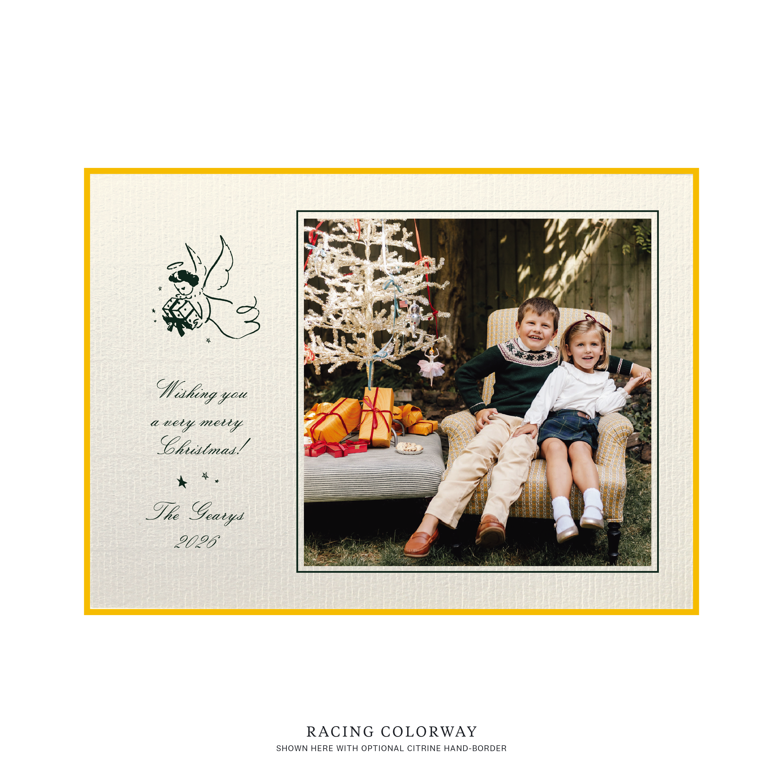 The Sutton personalized photo Christmas card by Stovall Collection, featuring a vintage Christmas angel, classic script typography and a family photograph on creamy laid paper.