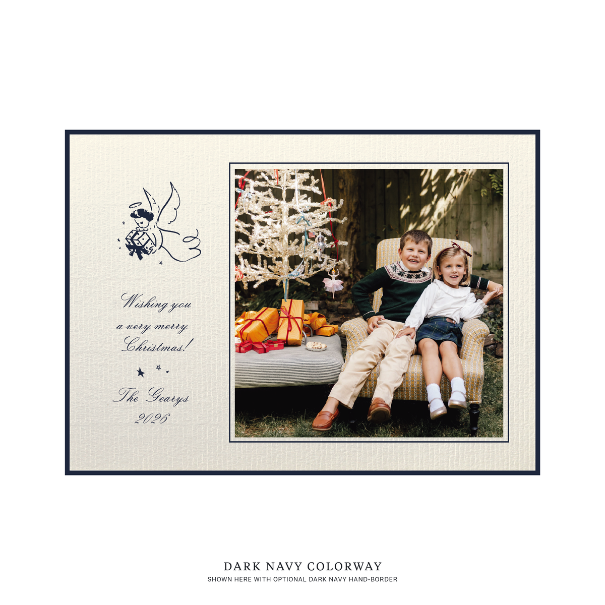 The Sutton personalized photo Christmas card by Stovall Collection, featuring a vintage Christmas angel, classic script typography and a family photograph on creamy laid paper.