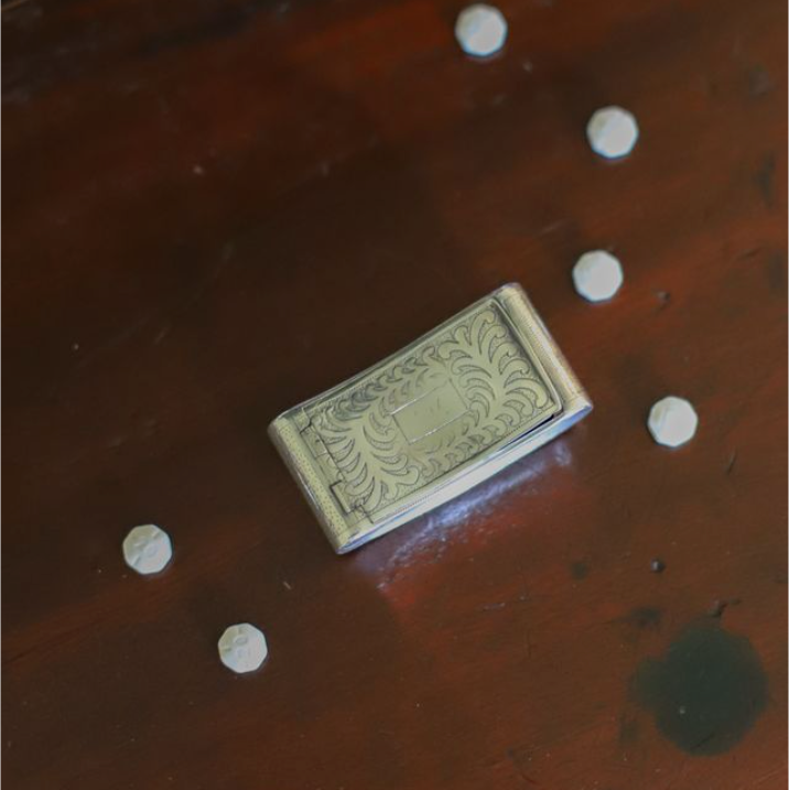 A tiny treasure with more than two centuries of history, this antique sterling silver box was made in Birmingham, England and hallmarked in 1818, during the reign of King George III