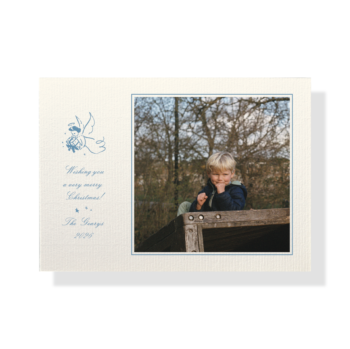 Detail view of Sutton Vintage Motif Classic Print Holiday Card with vintage angel, script greeting and mounted photo