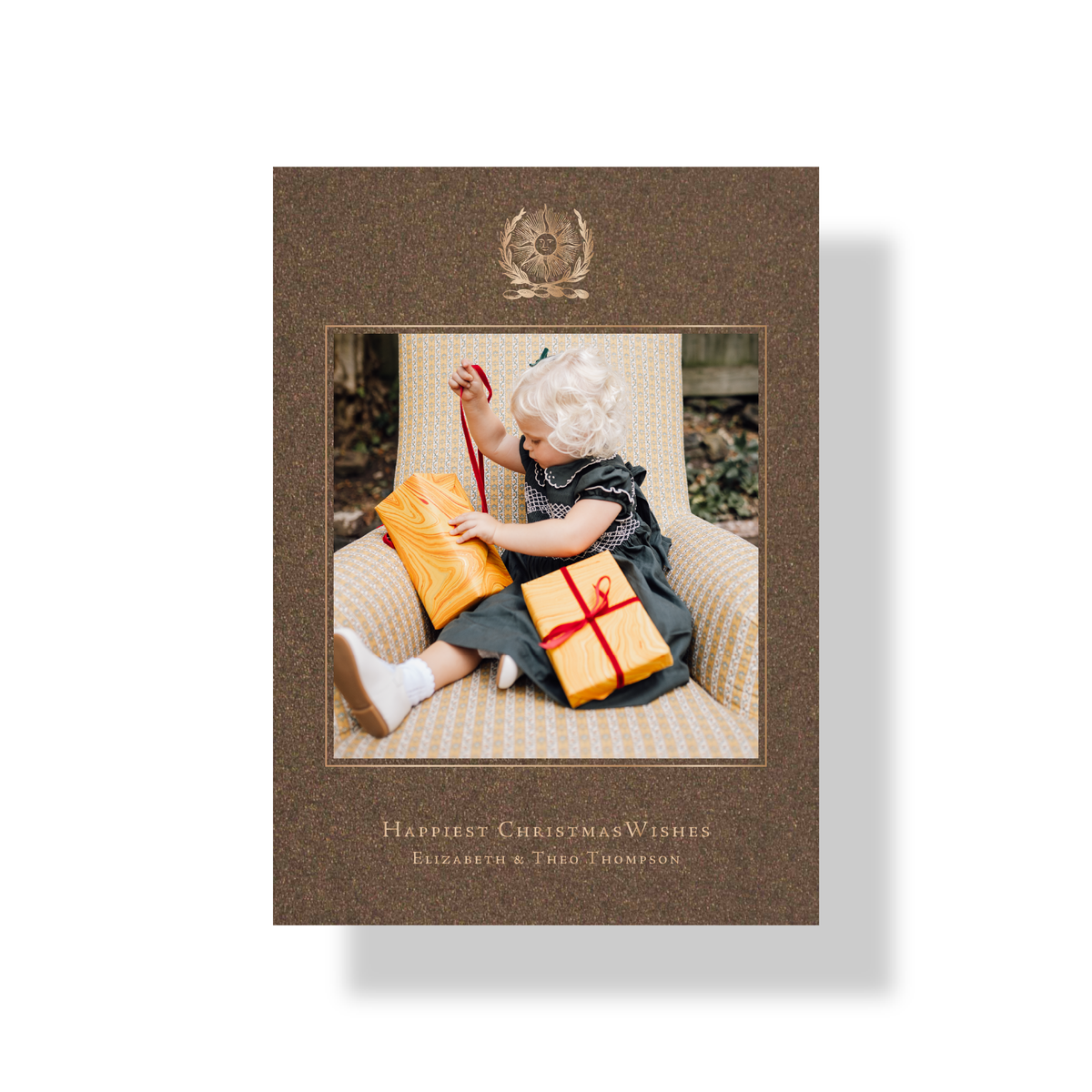 Thalia engraved photo holiday card in bronze shimmer paper with metallic champagne ink and celestial sun emblem