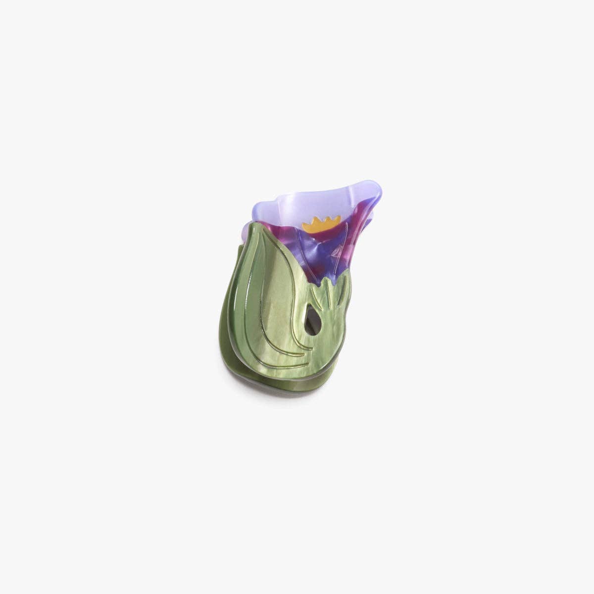 The Morning Glory Hair Claw features a delicate purple bloom and leafy green details, crafted from cellulose acetate for a petite floral statement.